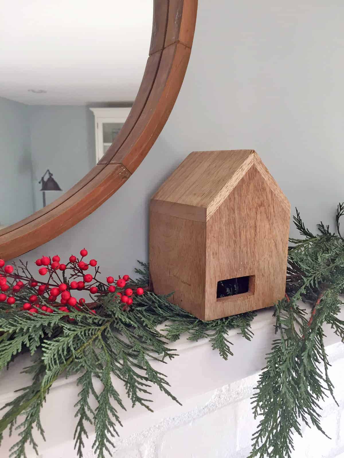 village house on christmas mantle