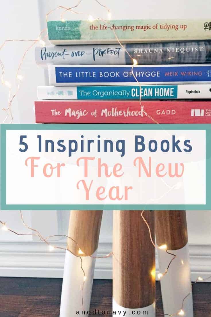 stack of books on a stool with fairy lights