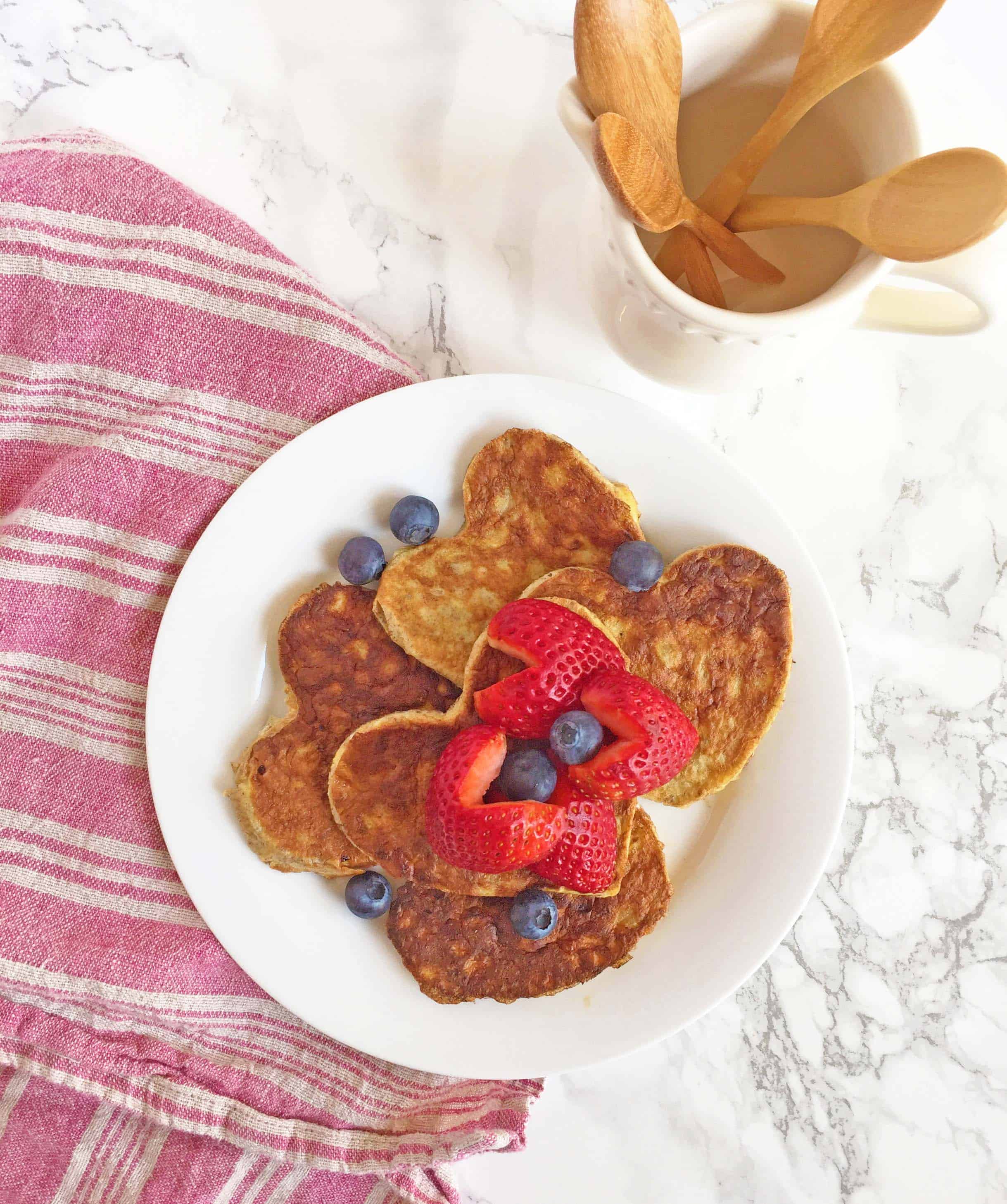 paleo pancakes, heart shaped pancakes with heart shaped strawberries