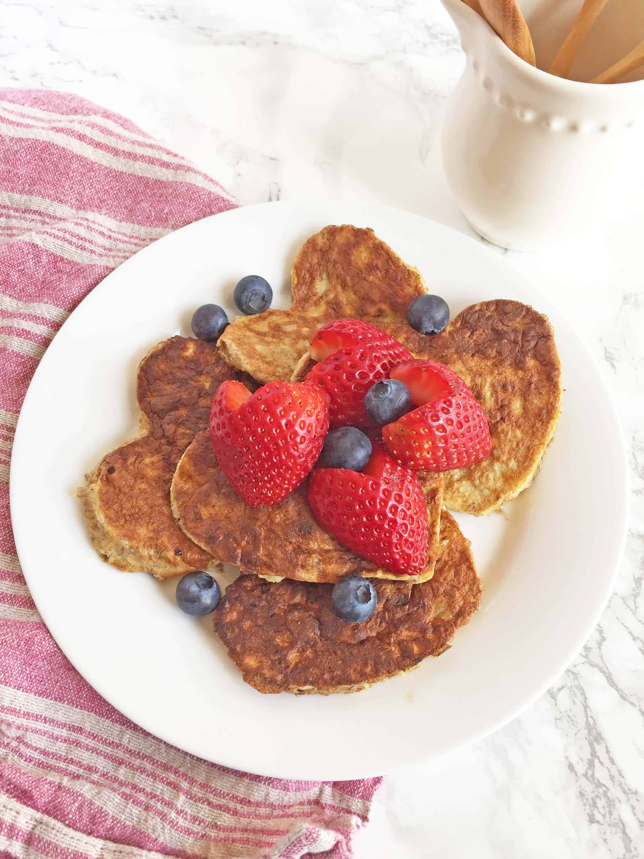 paleo pancakes, heart shaped pancakes with heart shaped strawberries