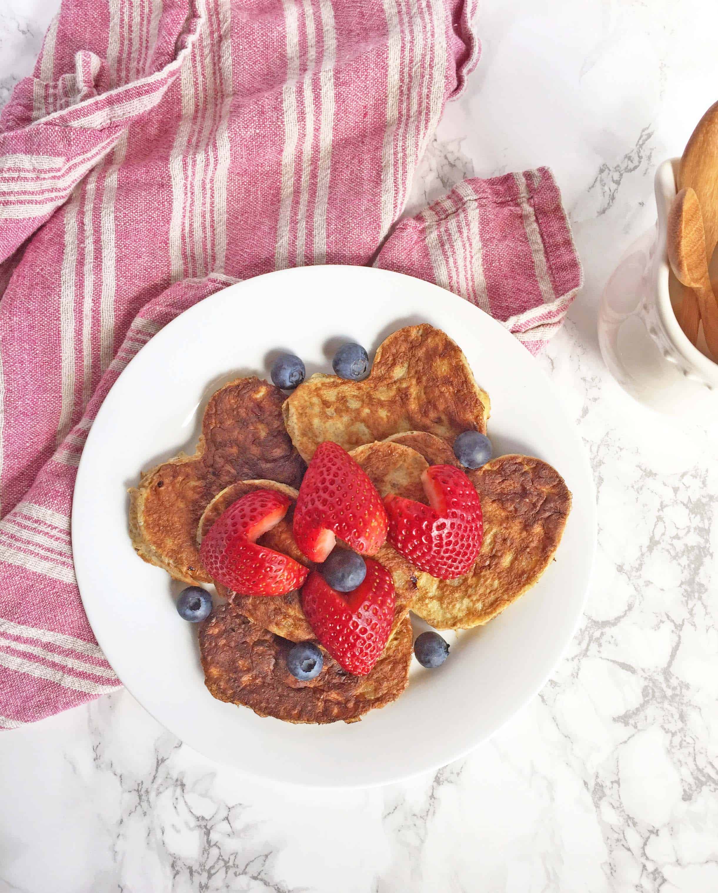 paleo pancakes, heart shaped pancakes with heart shaped strawberries