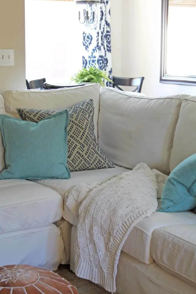 Family room home tour. #spring #coastalhome #farmhouse #potterybarn #sisalrug #moroccanpouf #crateandbarrel #ballarddesign