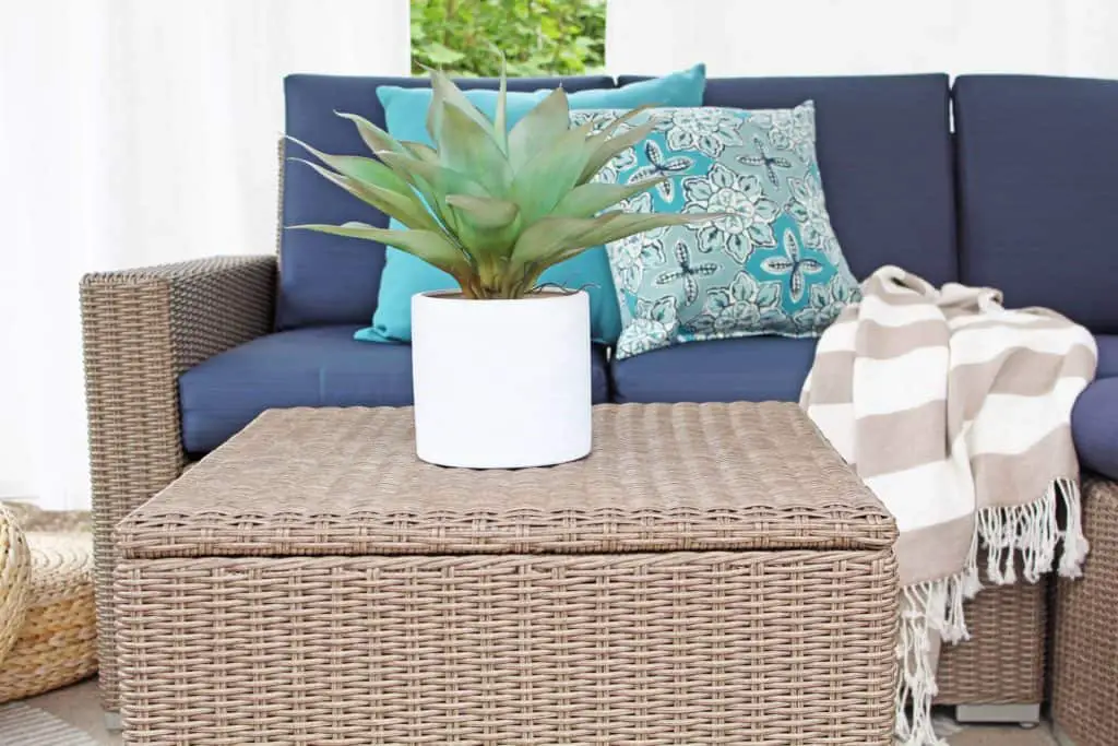 Summer is just around the corner, which means longer days and more outdoor time. Are you stuck on where to start with your outdoor space? Try these 5 simple patio makeover ideas.  #summerpatio #outdoorspace #outdoorlanterns #pergola #wickersectional #outdoorcurtains #outdoorrug #summerentertaining #outdoorlivingroom #bluedecor #aquadecor #backpatio #backyard #backdeck #smallyard