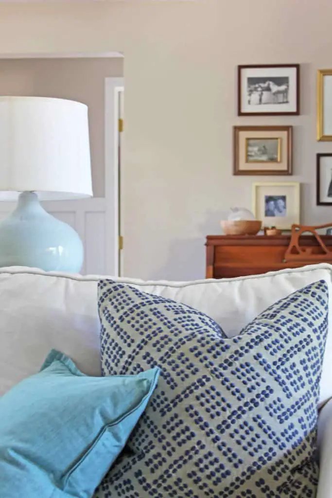 blue and aqua pillows on pottery barn couch