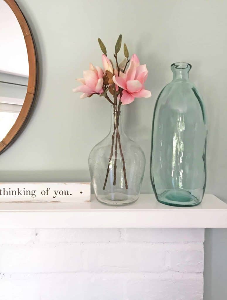 aqua glass vases on mantle