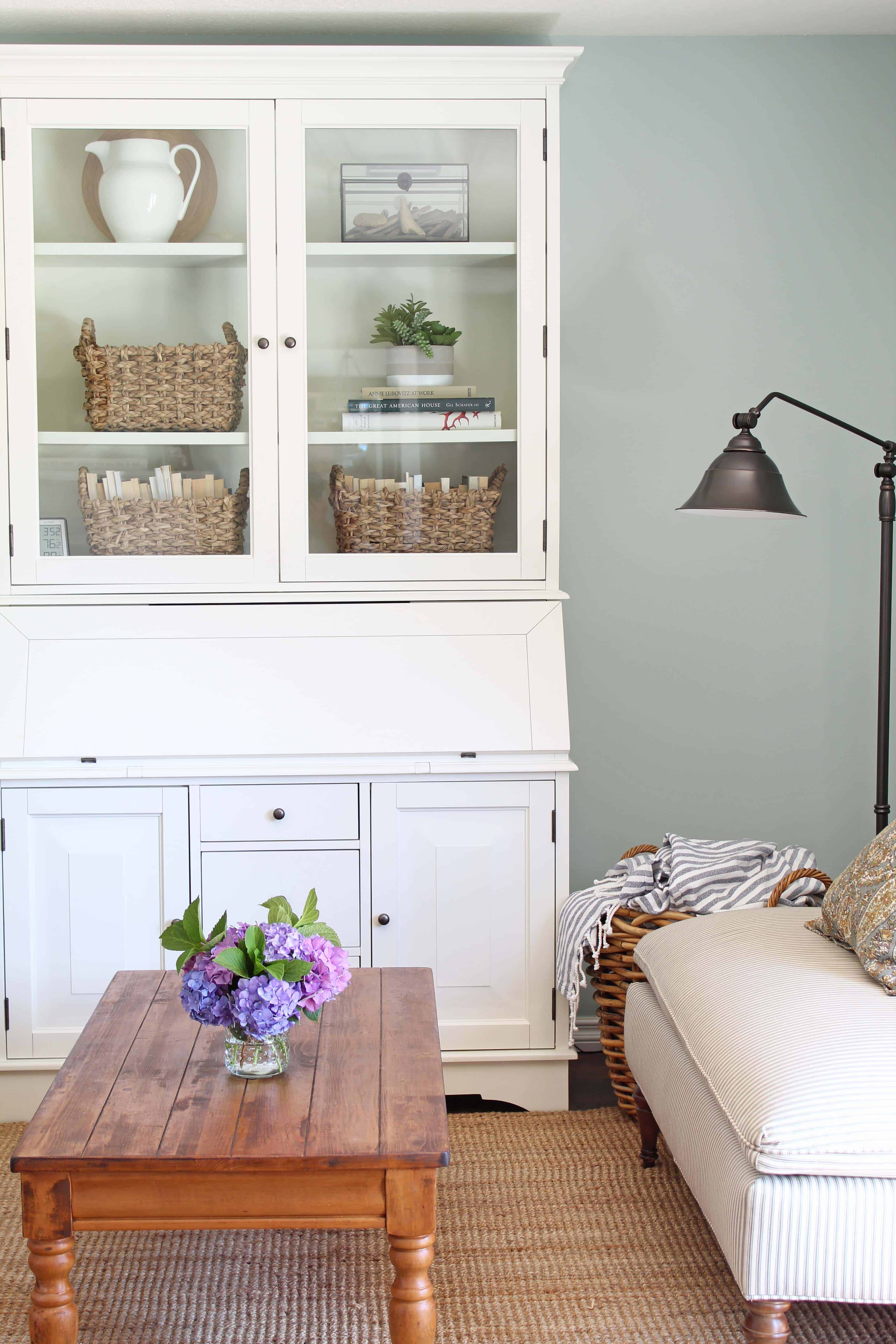 White pottery barn hutch in room with aqua walls