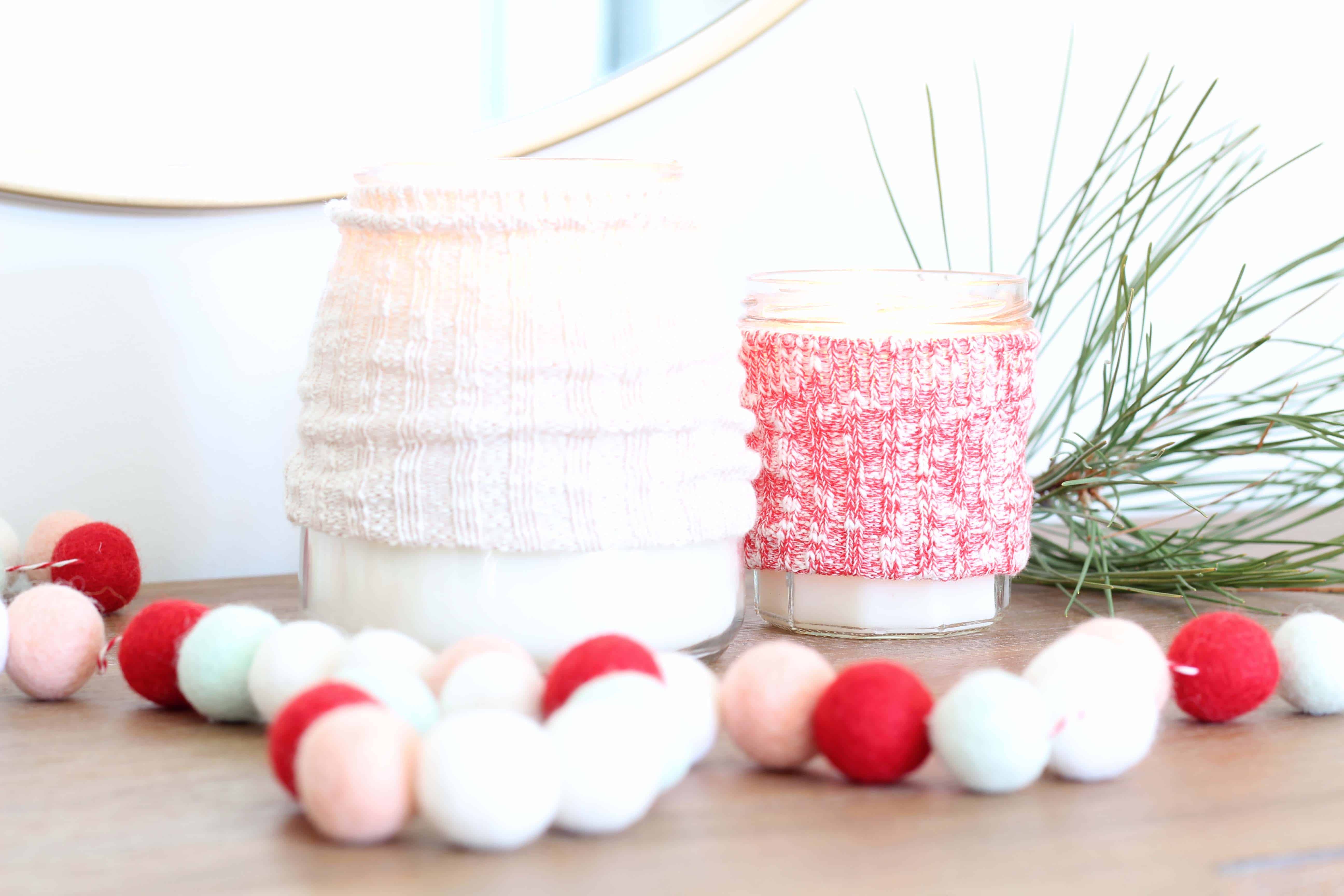 candles with sweater cozy and pom pom garland