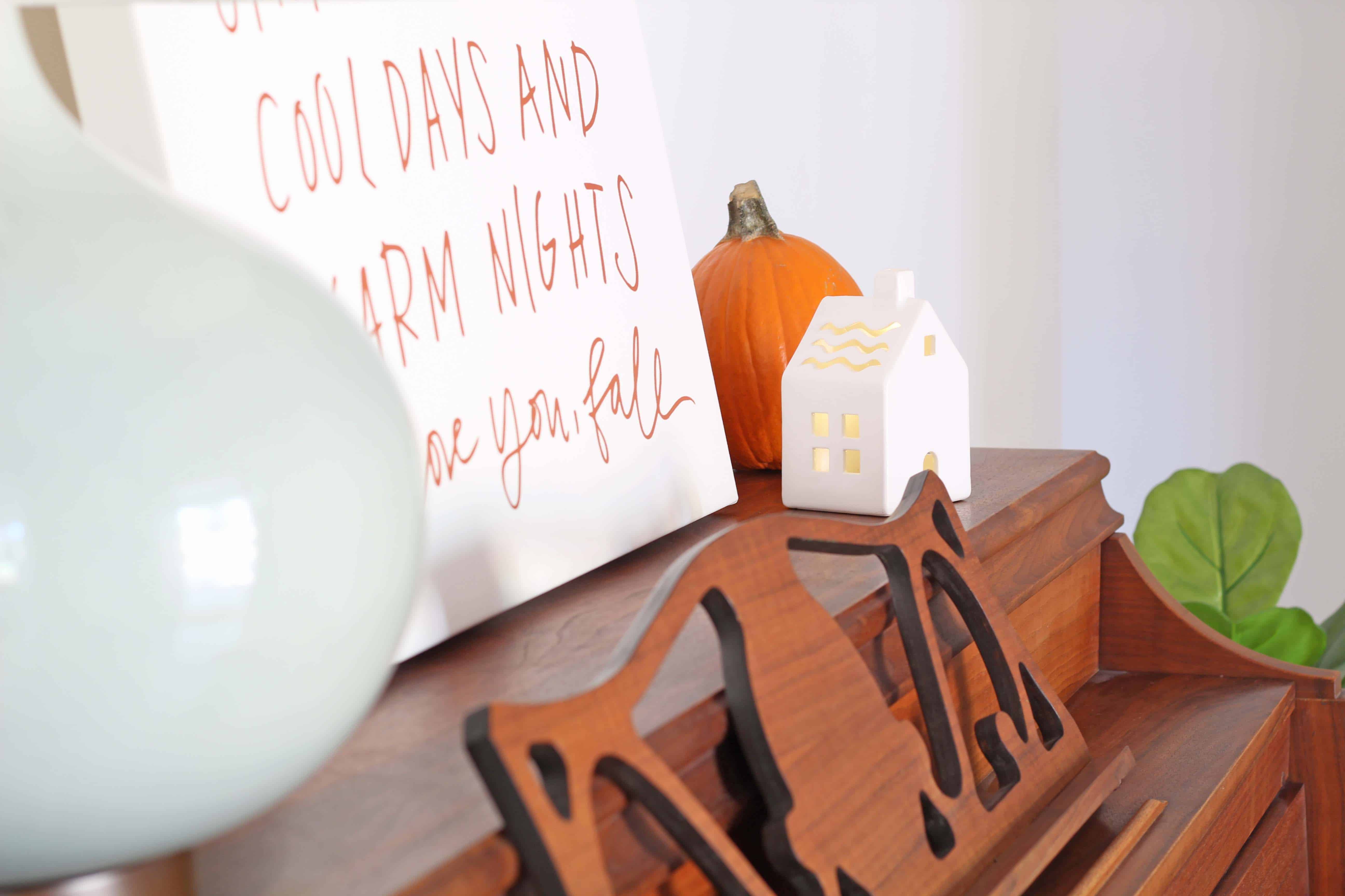 Fall entryway with lindsay letters word art and ceramic village house