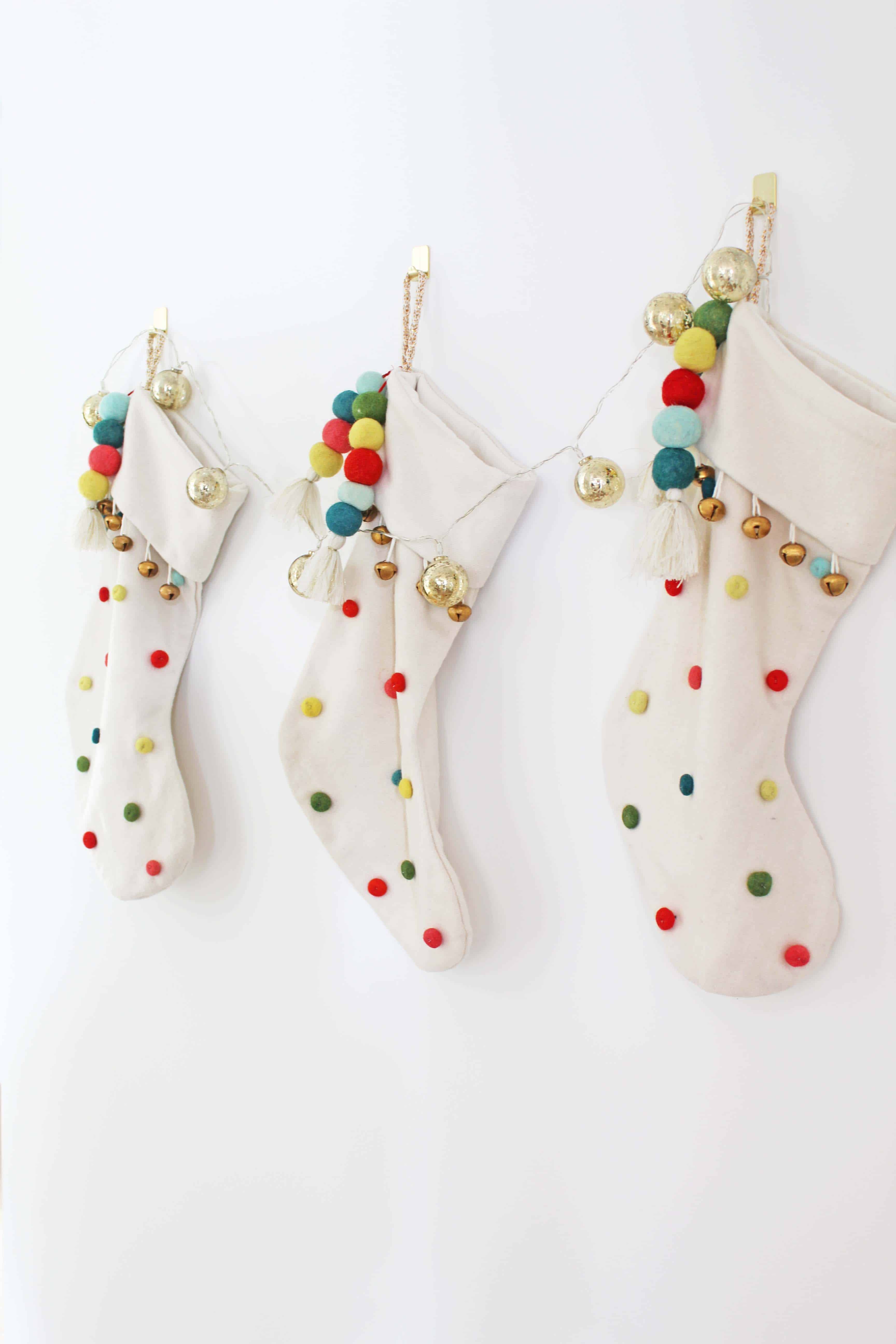 christmas stockings with pom poms and bells