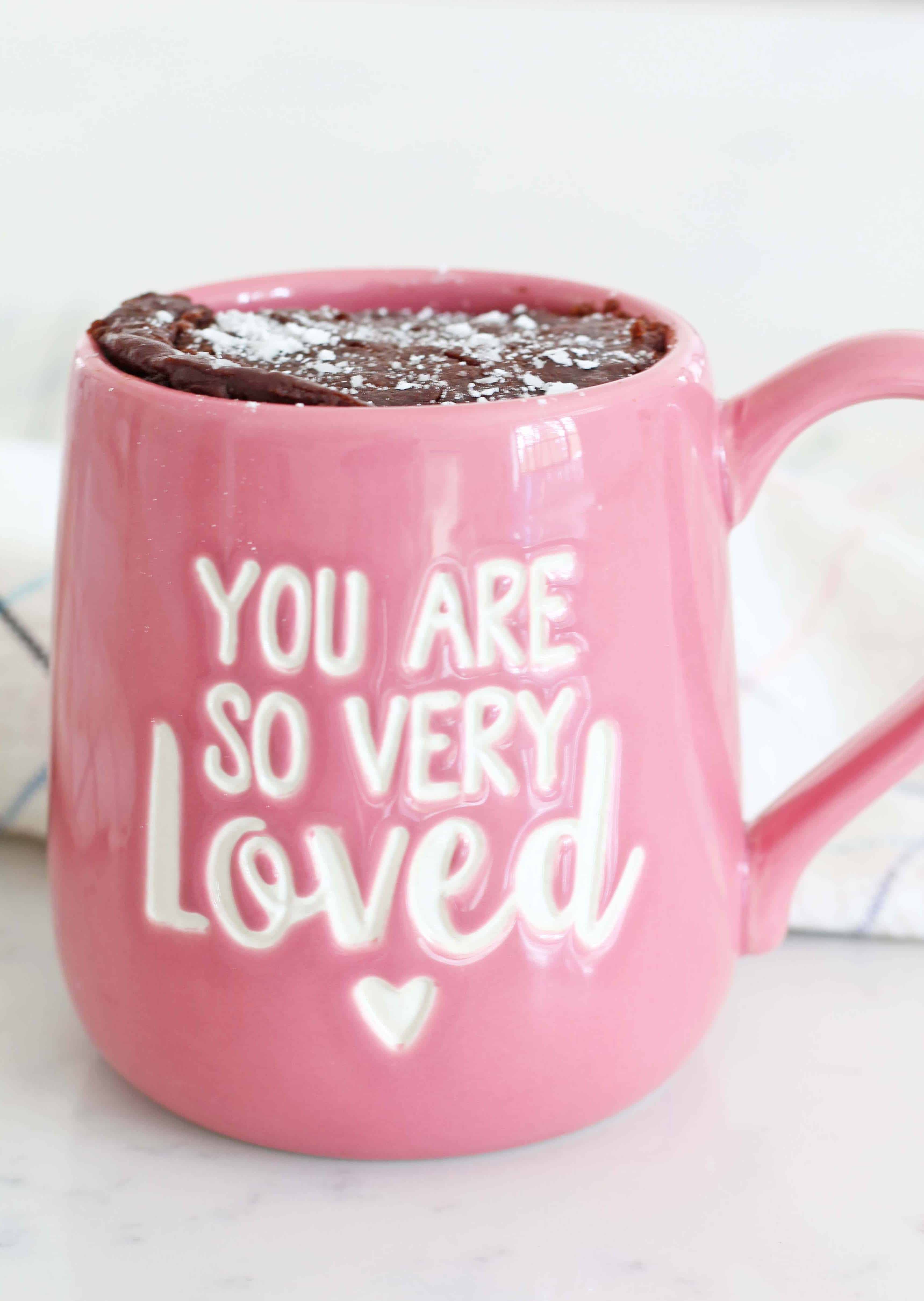 our name is mud mug, chocolate cake in a pink coffee mug