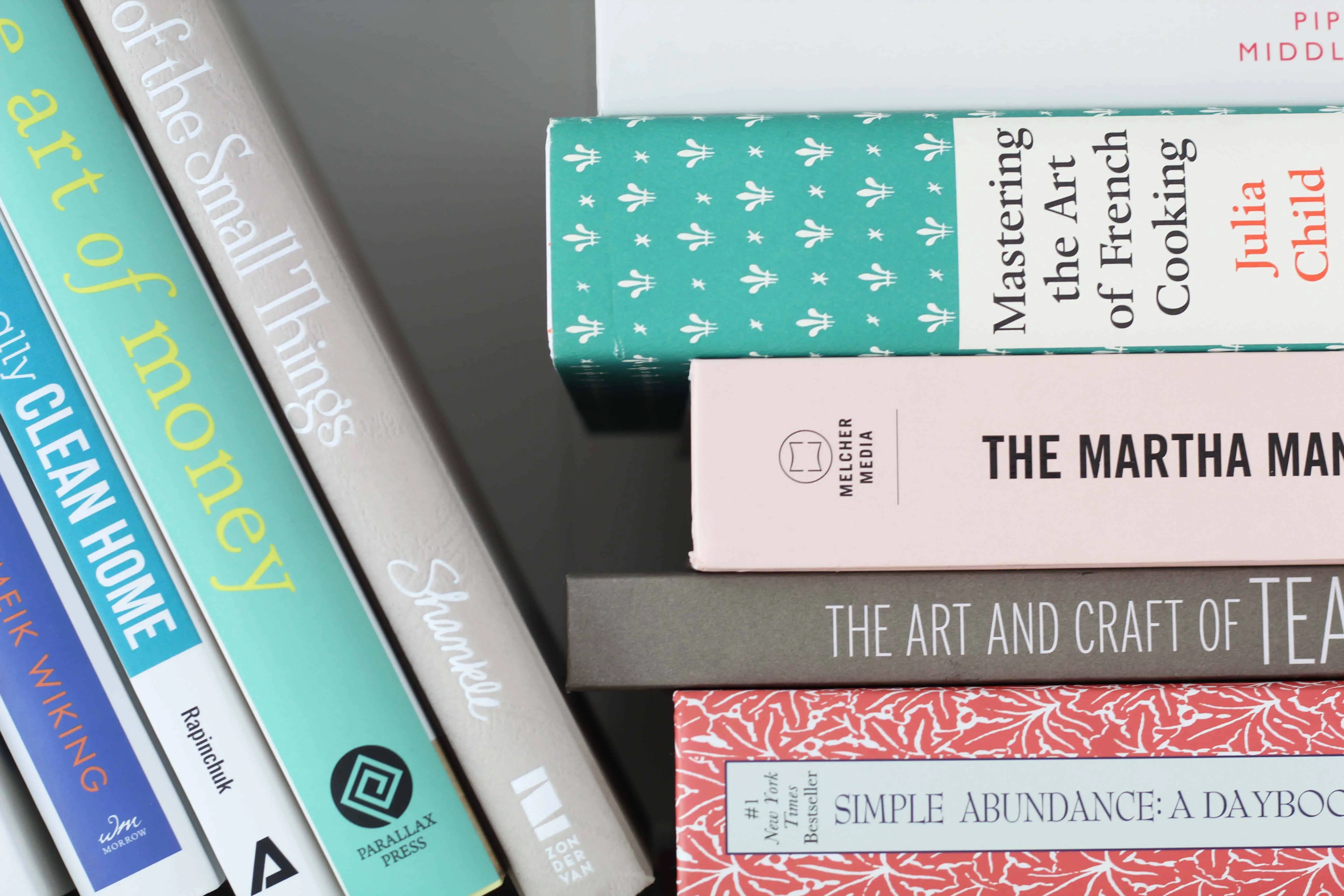 stack of colorful books, mastering the art of french cooking, the martha manual