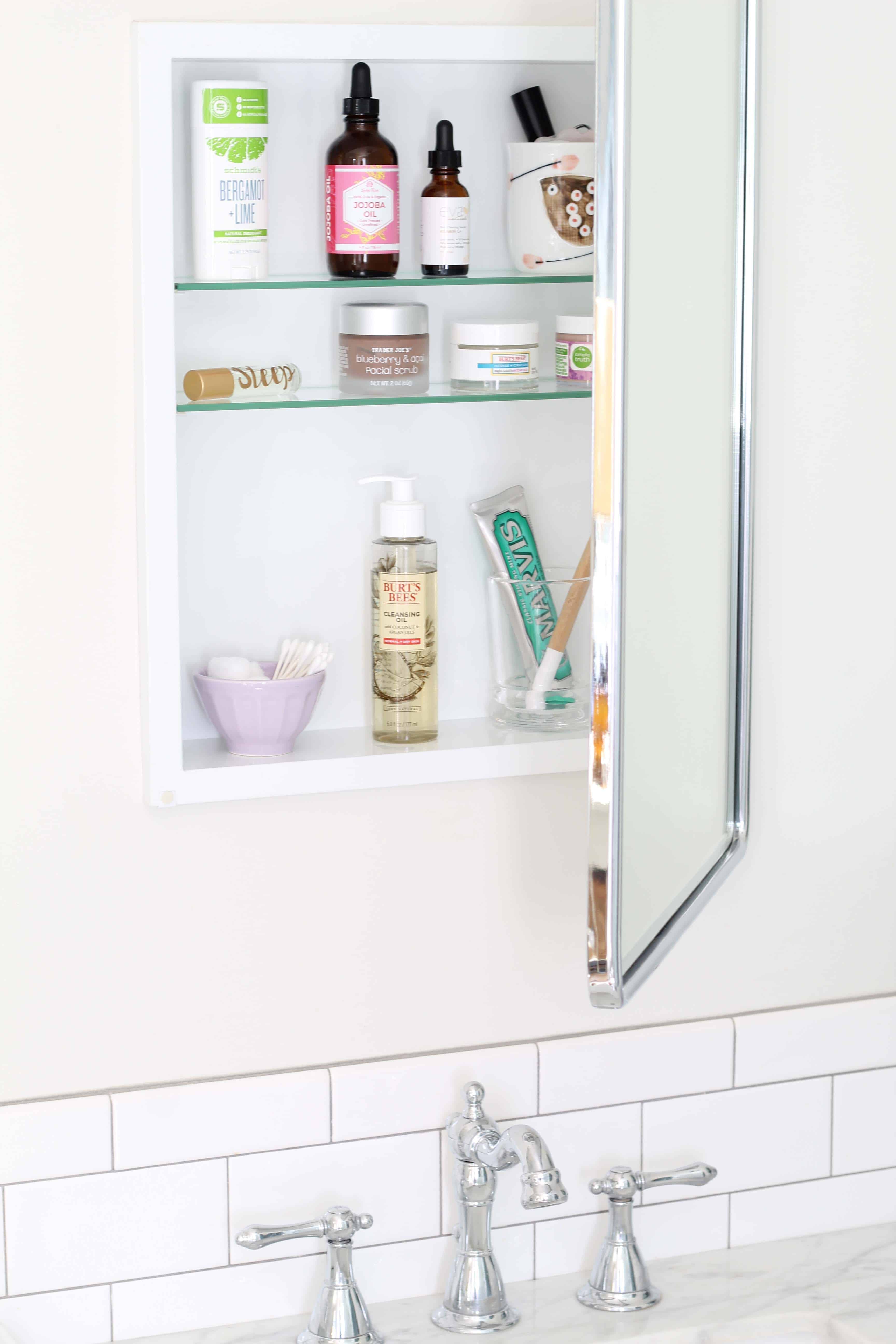 pottery barn recessed medicine cabinet with anthropologie latte bowl, jojoba oil, schmidts deodorant, wood dip dyed toothbrush 