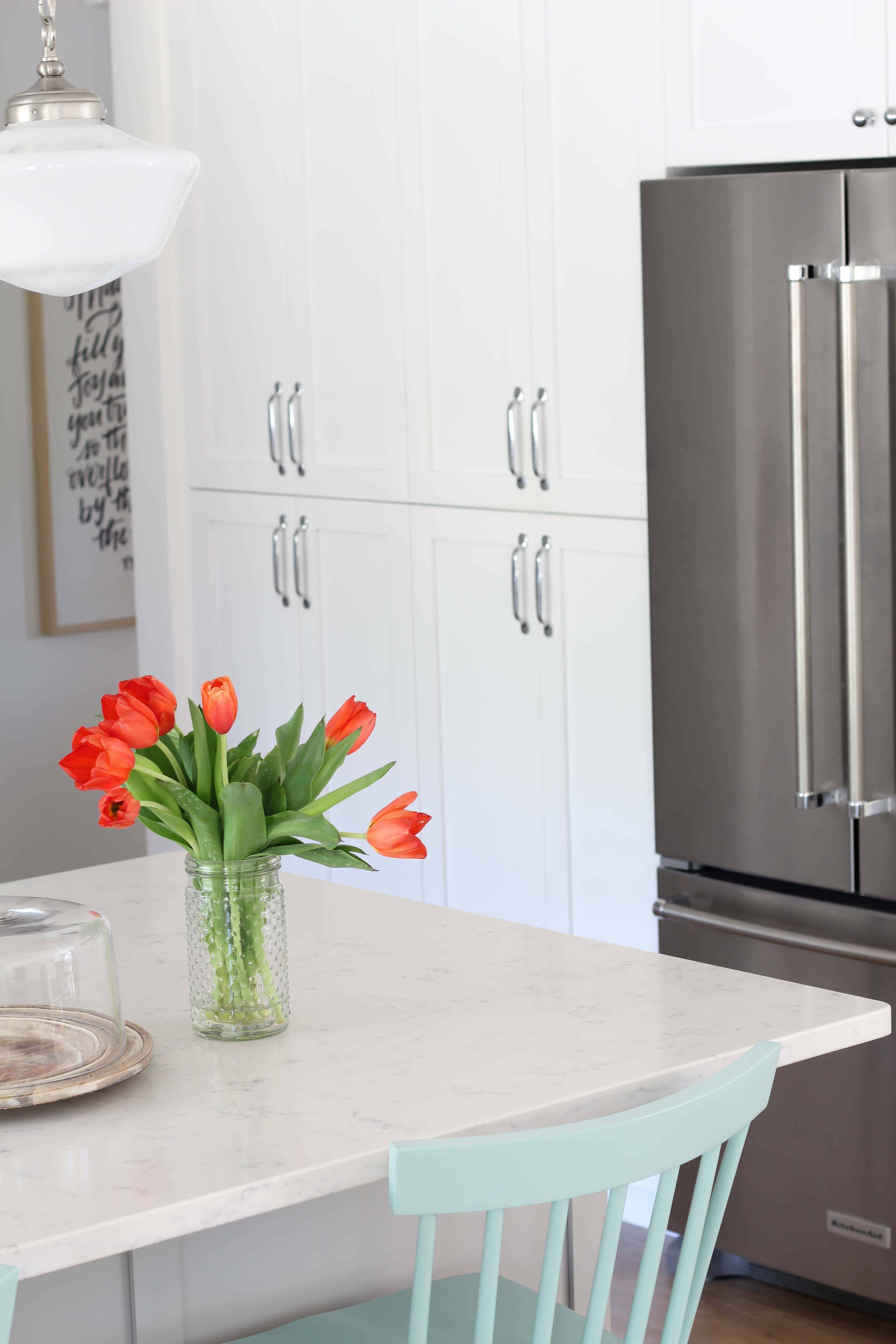 modern farmhouse kitchen with white vertical shiplap backsplash and open shelving