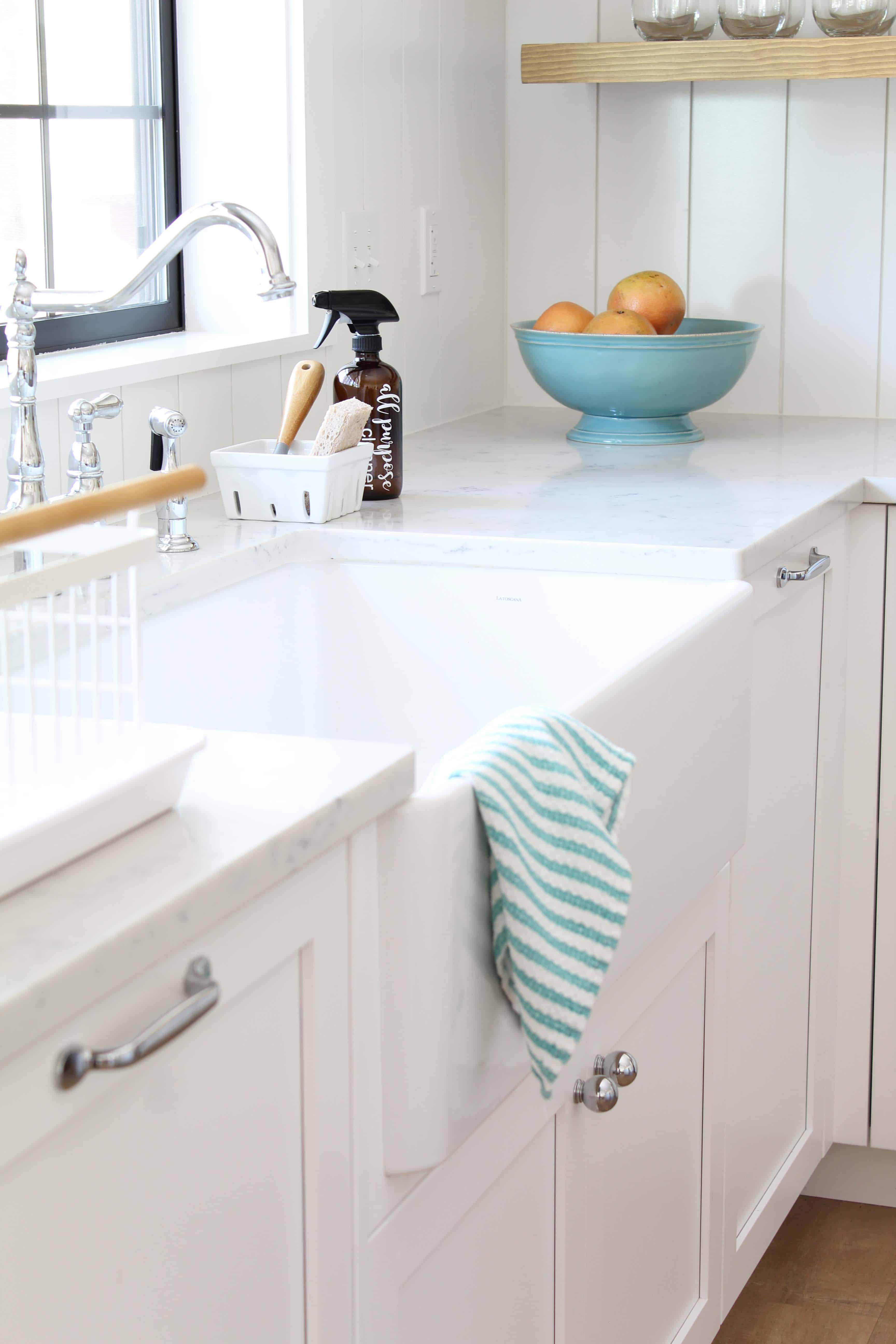 modern farmhouse kitchen with white vertical shiplap backsplash and open shelving