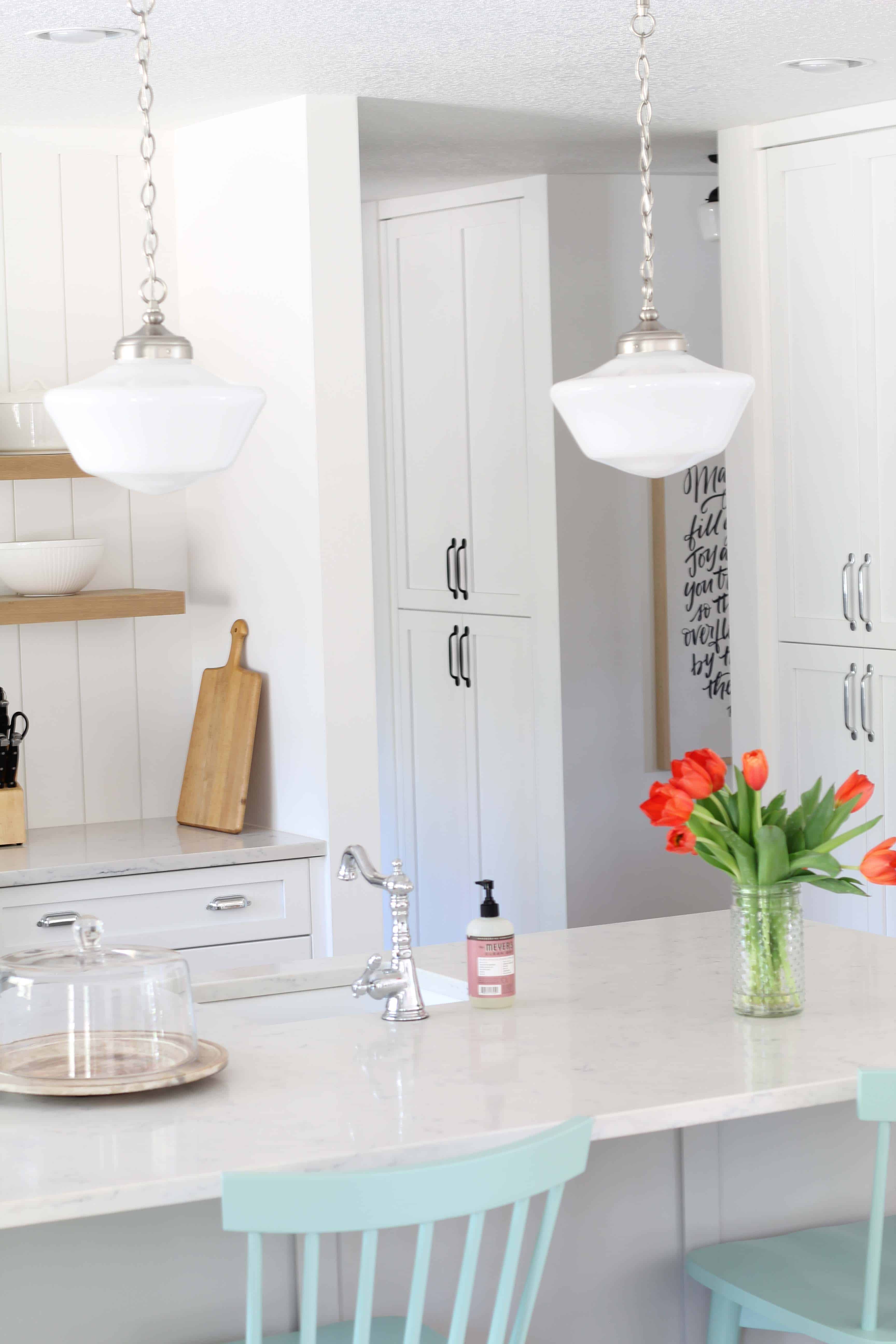 modern farmhouse kitchen with white vertical shiplap backsplash and open shelving