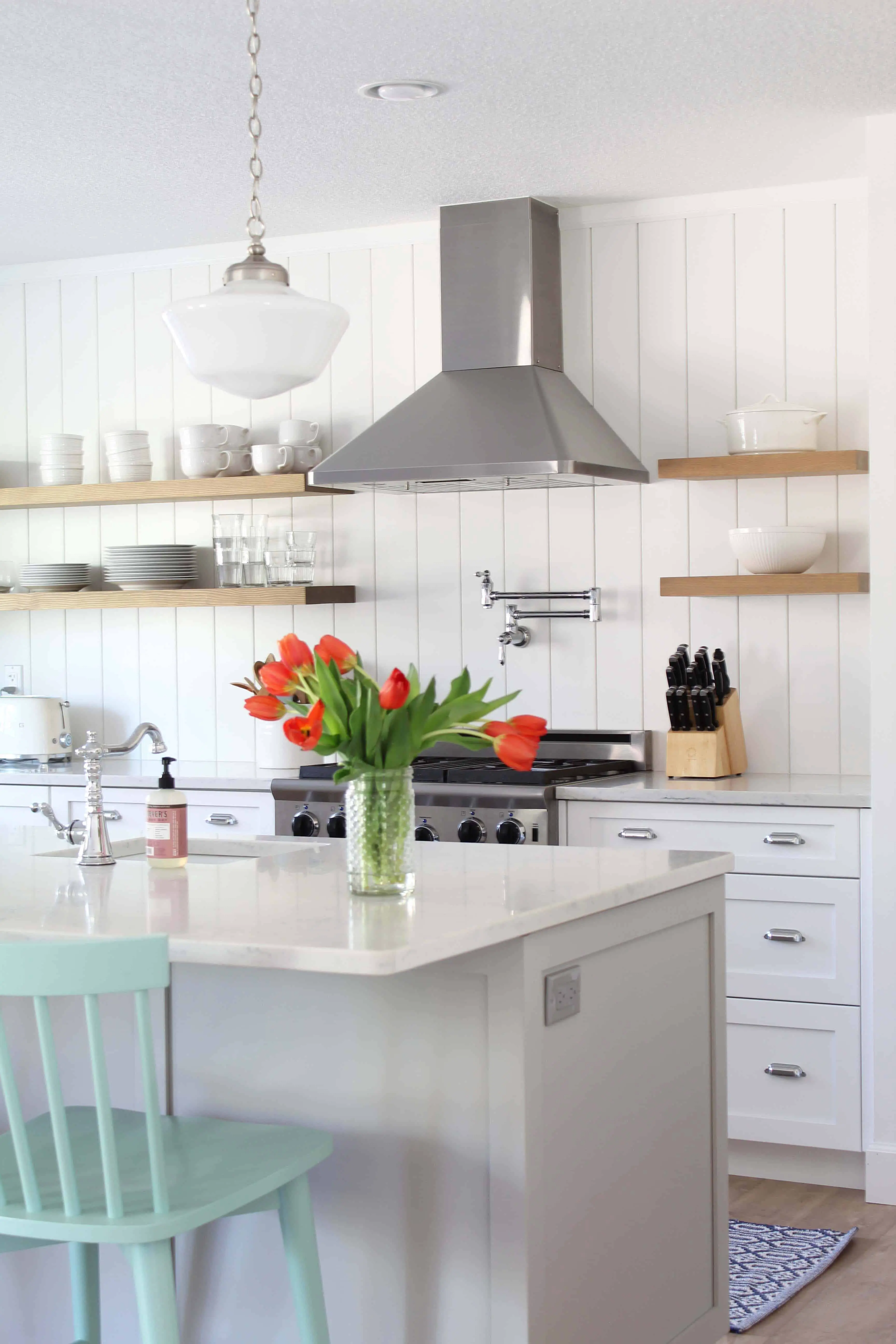 white farmhouse kitchen with metrie pre painted shiplap, vertical shiplap, aqua barstools, snag toaster