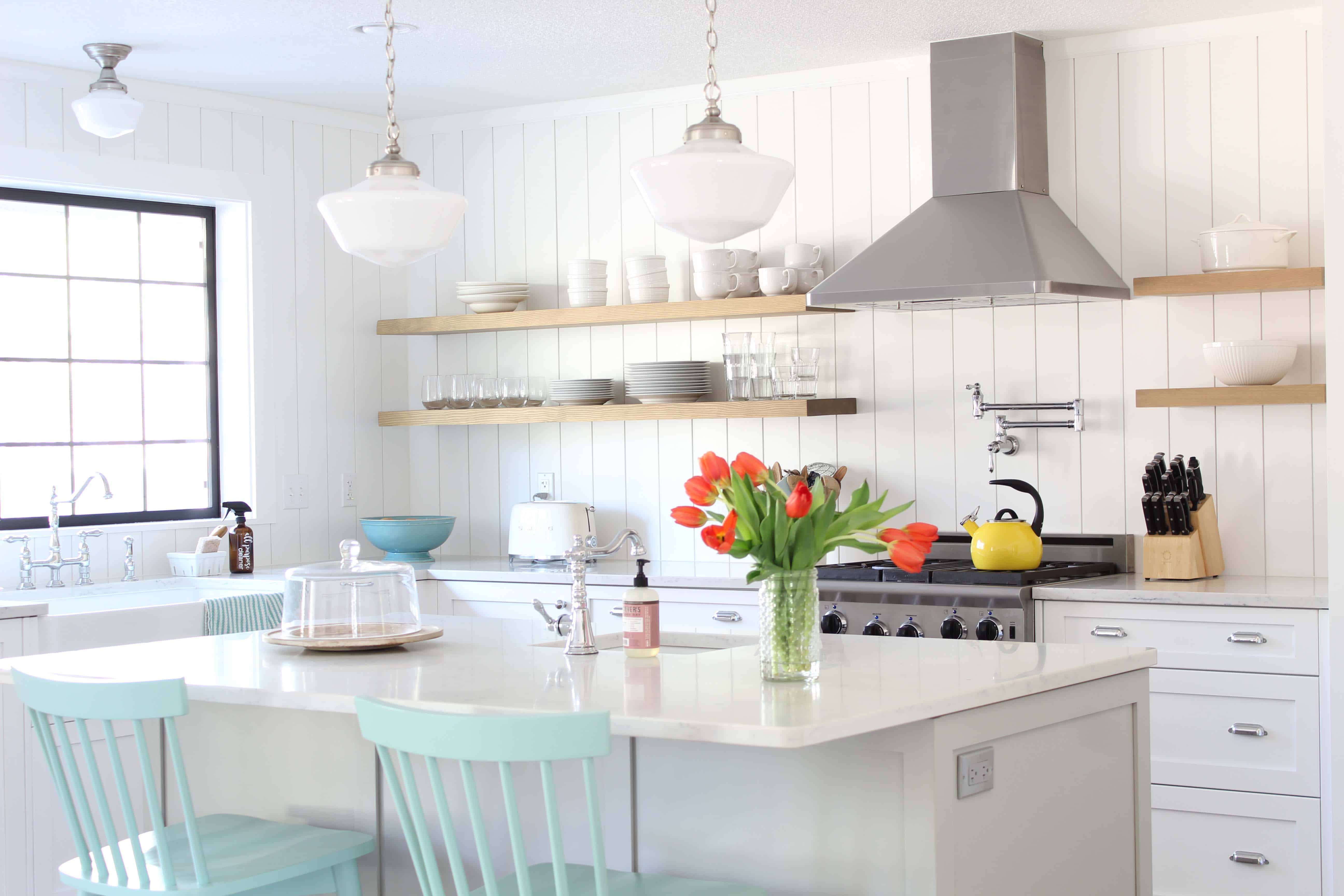 modern farmhouse kitchen with white vertical shiplap backsplash and open shelving