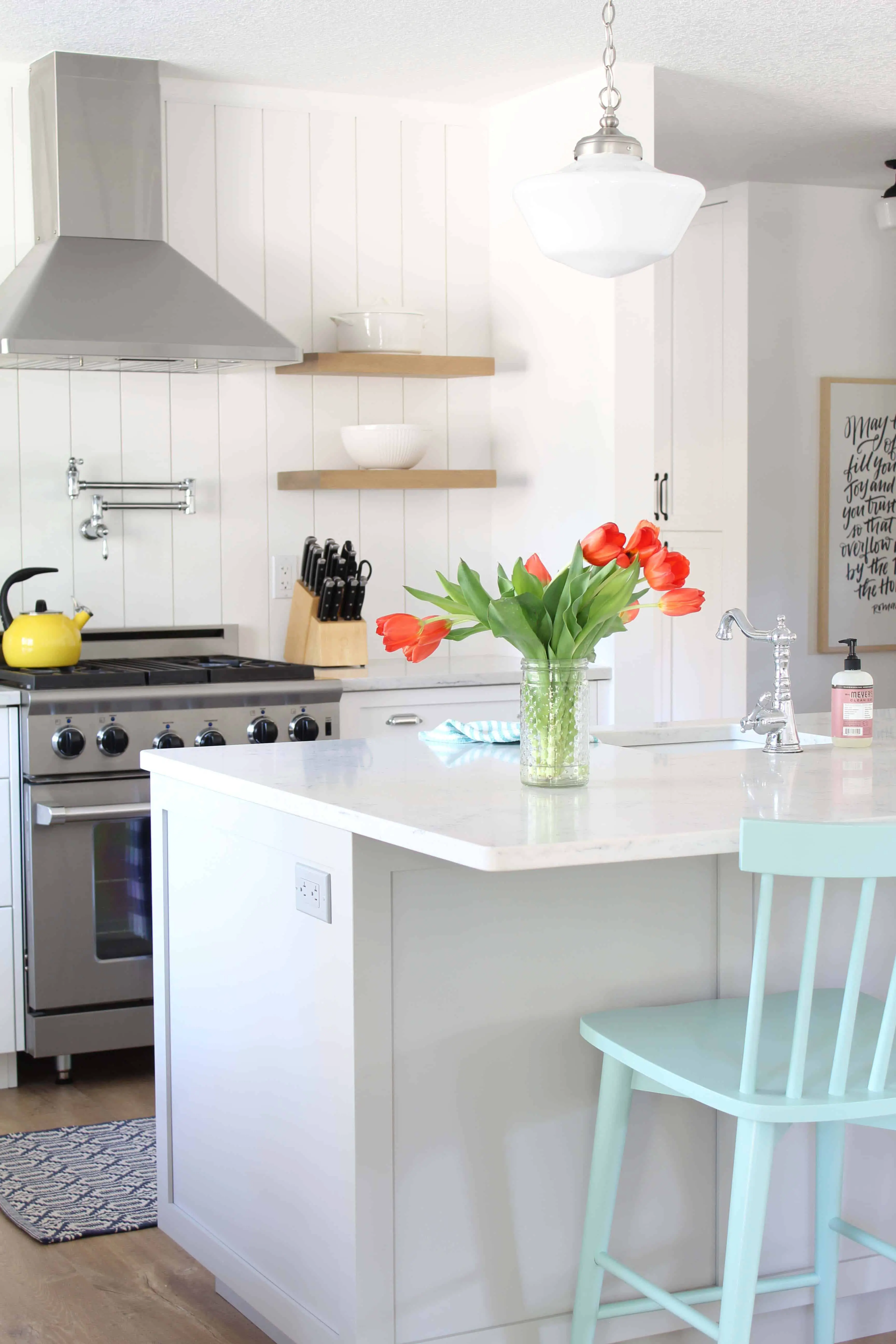 modern farmhouse kitchen with white vertical shiplap backsplash and open shelving