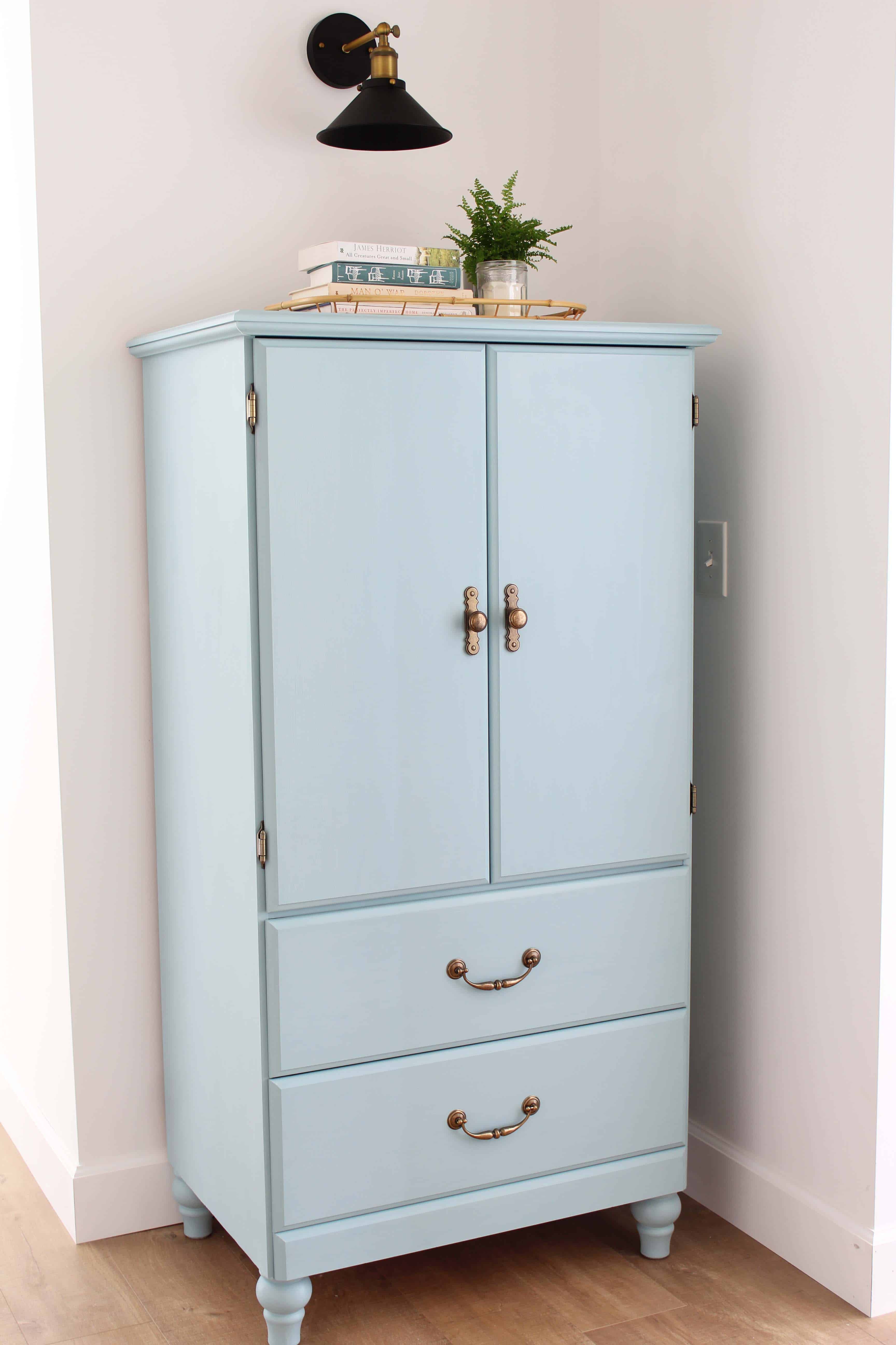 small armoire painted in kilz juniper blue chalk paint, modern farmhouse black wall sconce, bamboo serving tray
