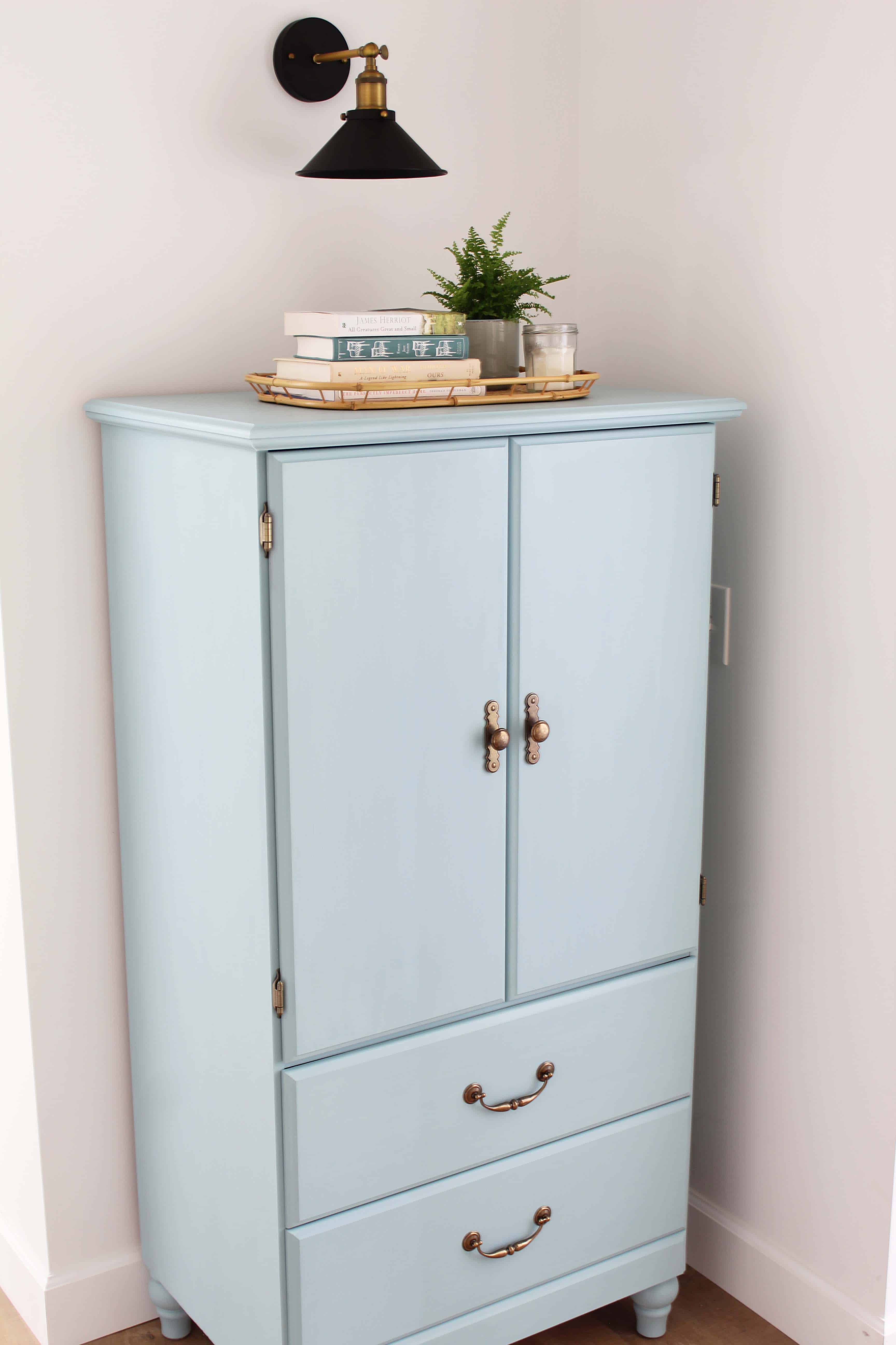 small armoire painted in kilz juniper blue chalk paint, modern farmhouse black wall sconce, bamboo serving tray