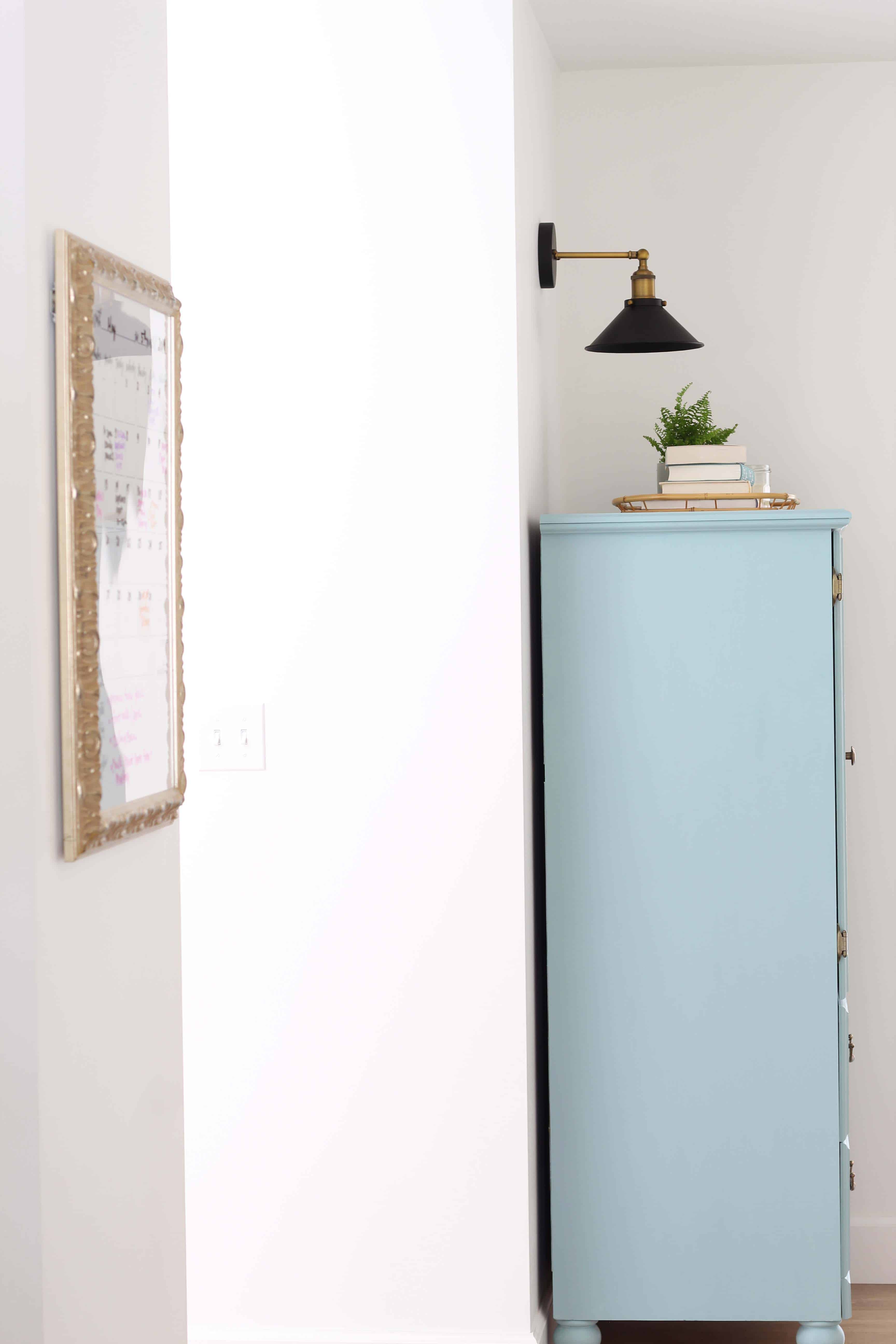 small armoire painted in kilz juniper blue chalk paint, modern farmhouse black wall sconce, bamboo serving tray