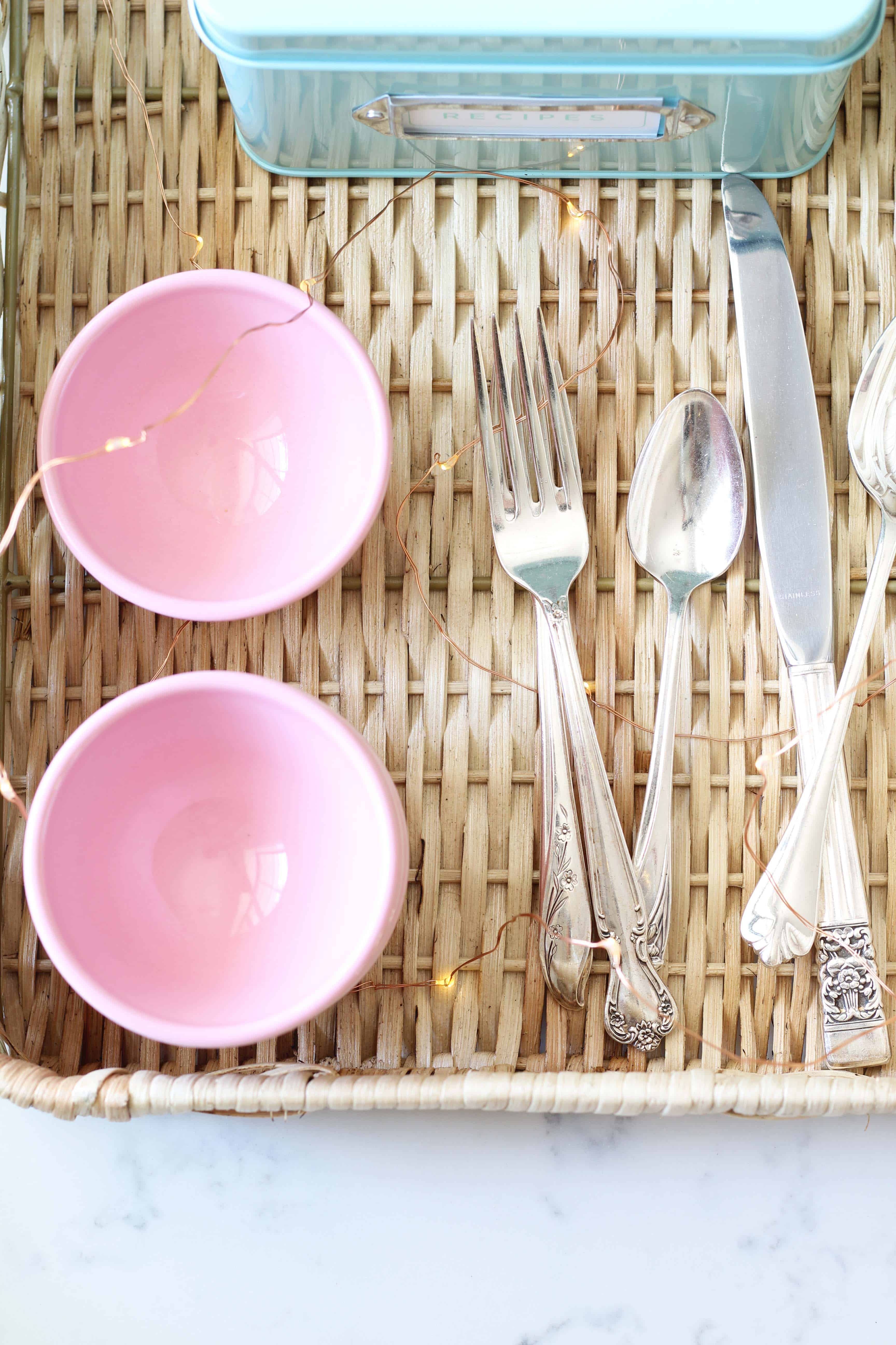 vintage silverware in a mason jar, anthropologie pink mini latte bowls, aqua recipe tin, mini fairy lights