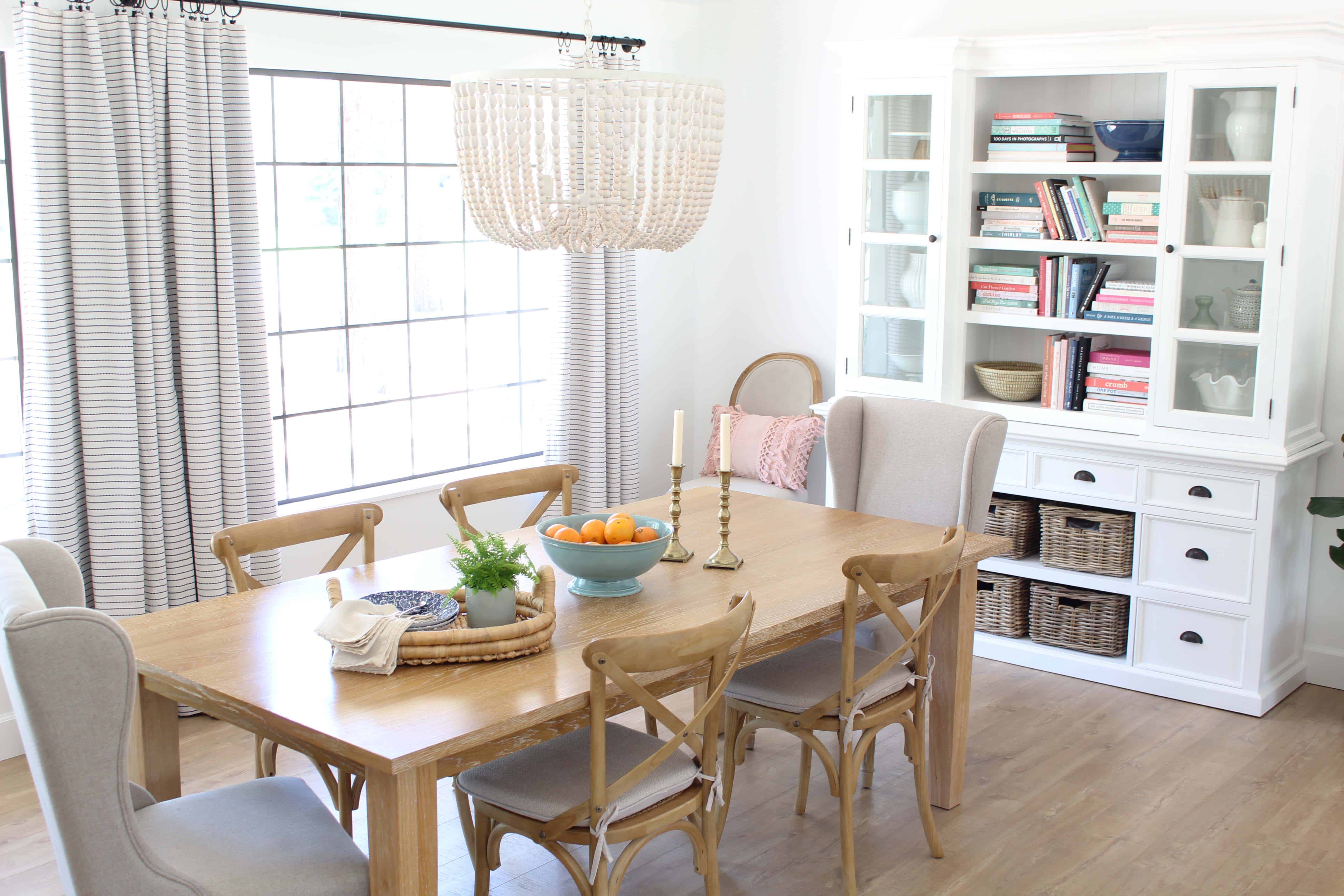 world market beaded chandelier, parsons light wood dining table, novo solo halifax library hutch