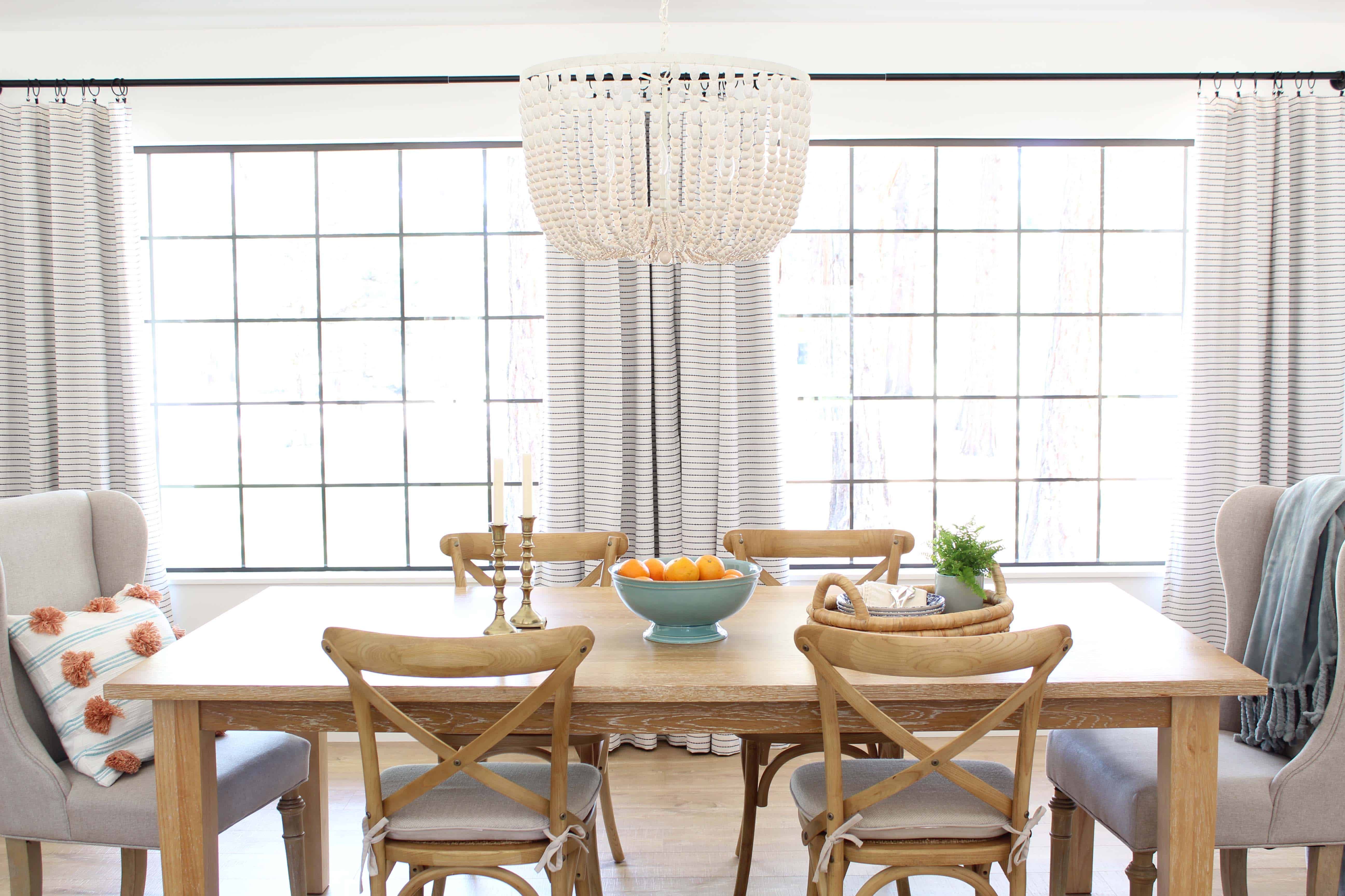 pier 1 dining room table, farmhouse bistro chairs, world market beaded chandelier