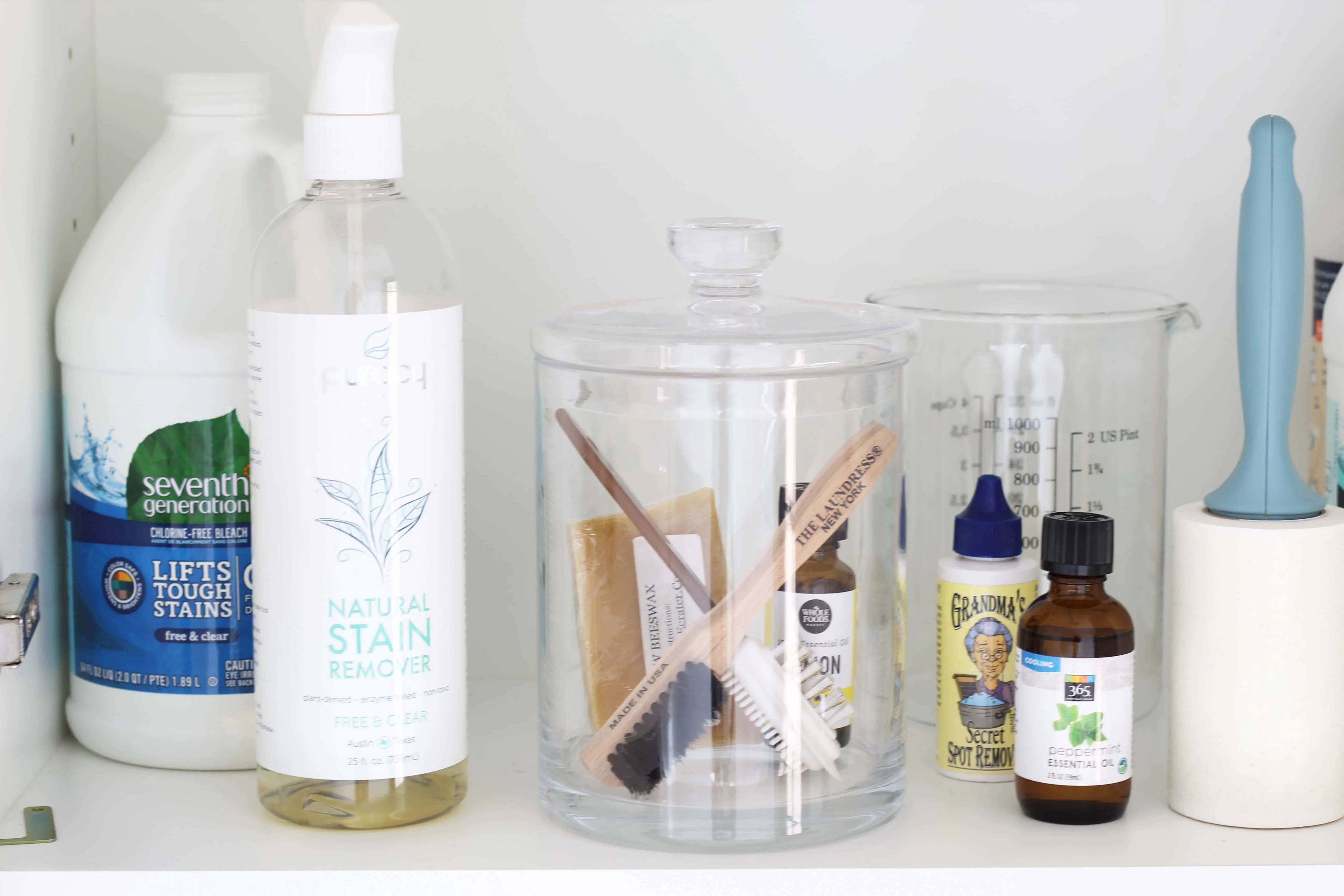 laundry room shelf organization with glass canister