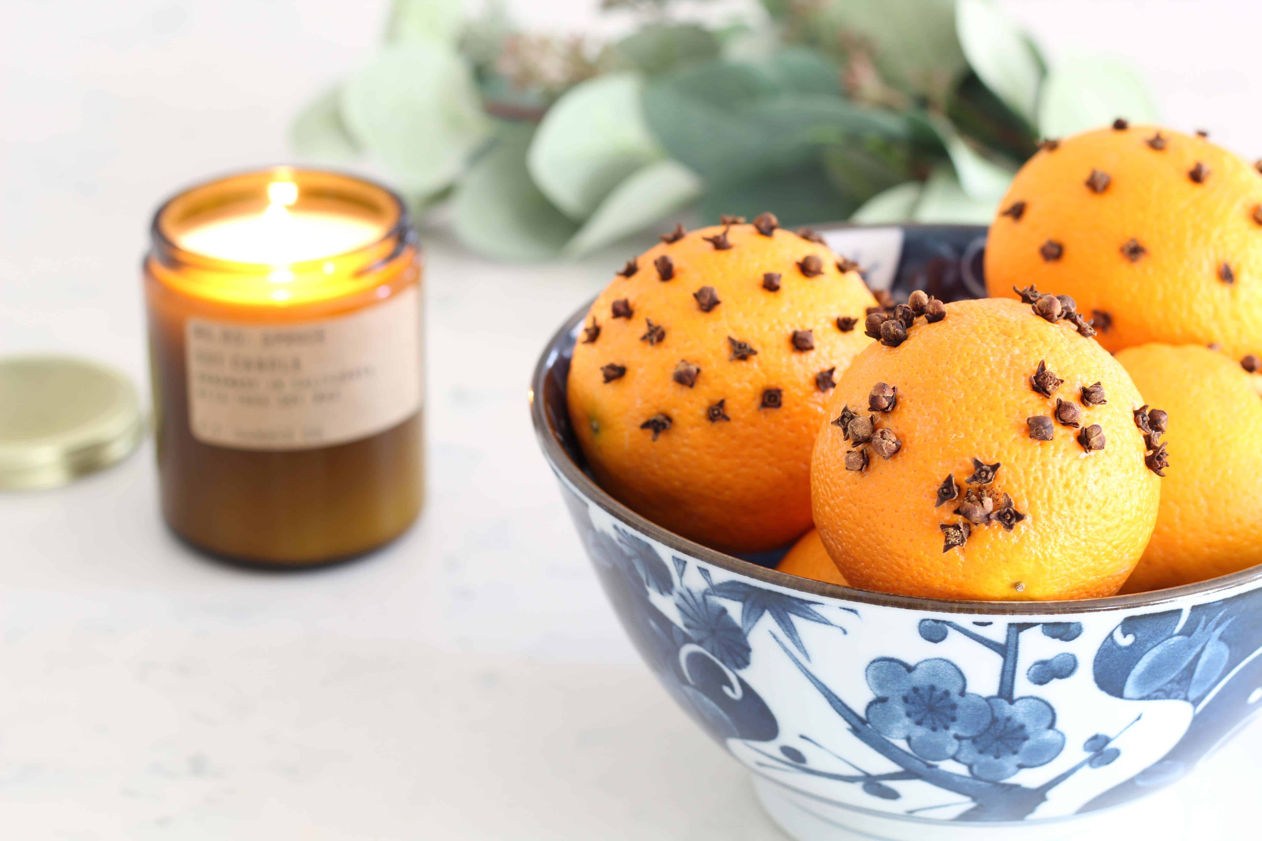 P.F. candle co spruce candle, orange pomander balls, faux eucalyptus stems