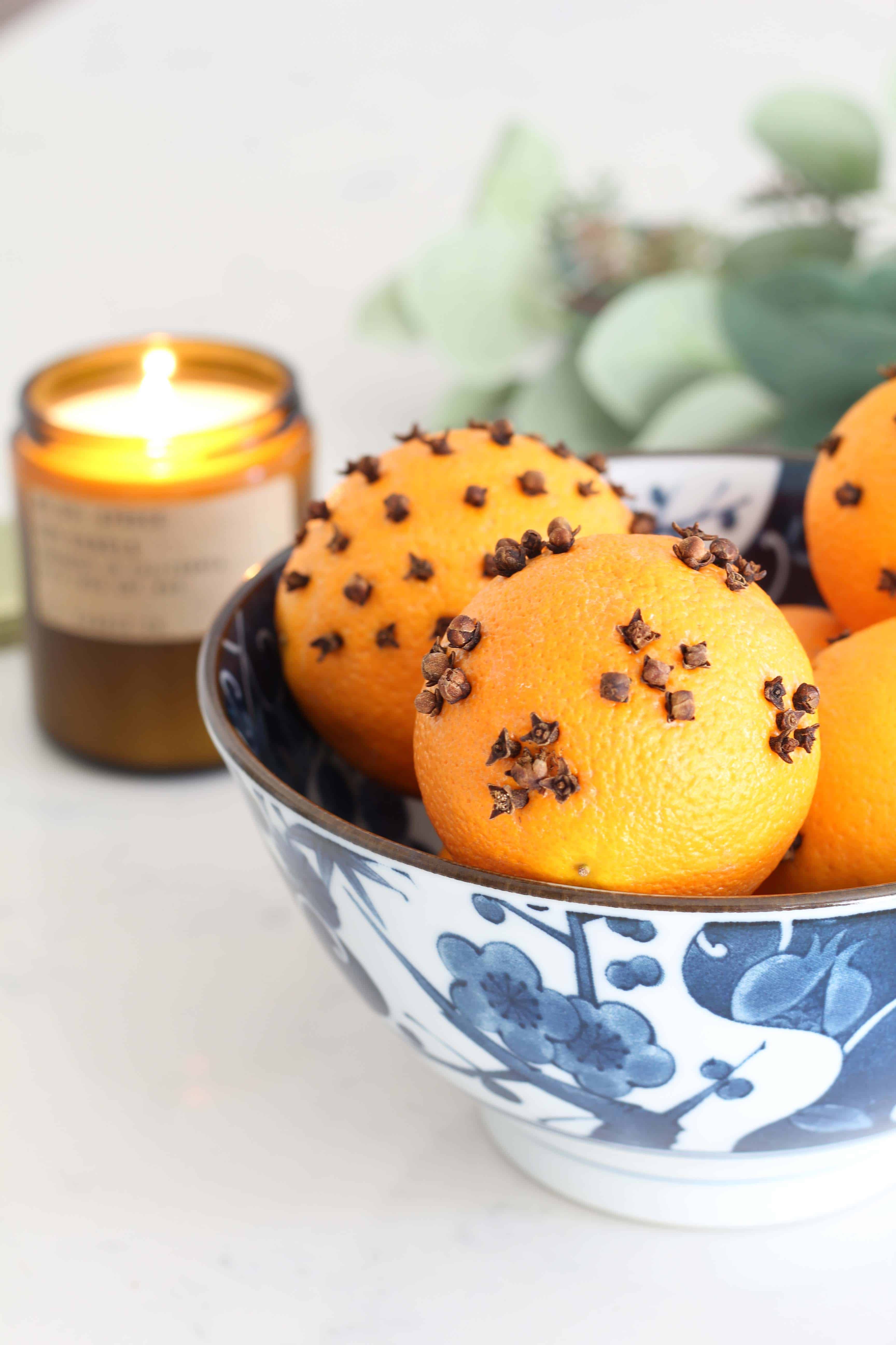 P.F. candle co spruce candle, orange pomander balls, faux eucalyptus stems