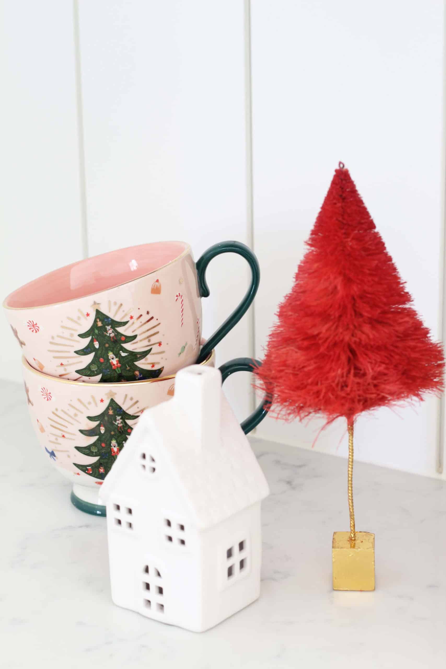 glitterville red bottle brush tree, rifle paper co. pink christmas tree mugs, target wonder shop ceramic christmas village houses