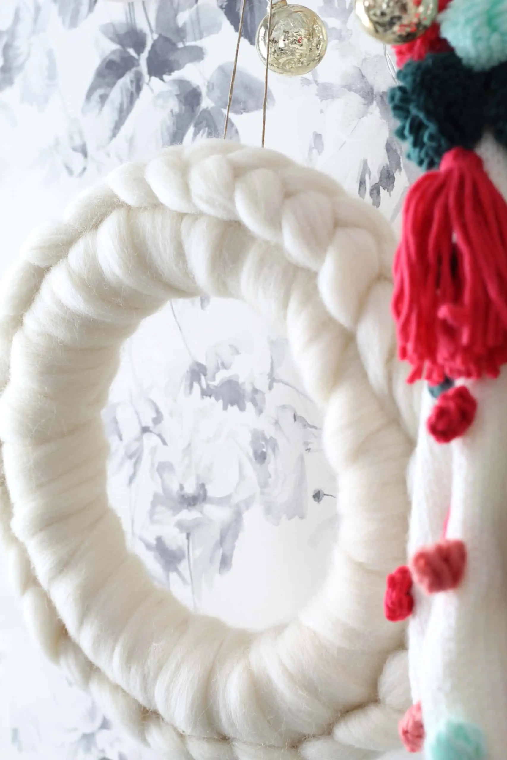 anthropologie white wool wreath, anthropologie christmas wreath, diy anthropologie wreath, anthropologie pom pom christmas stockings, smoky rose wallpaper by house of hackney