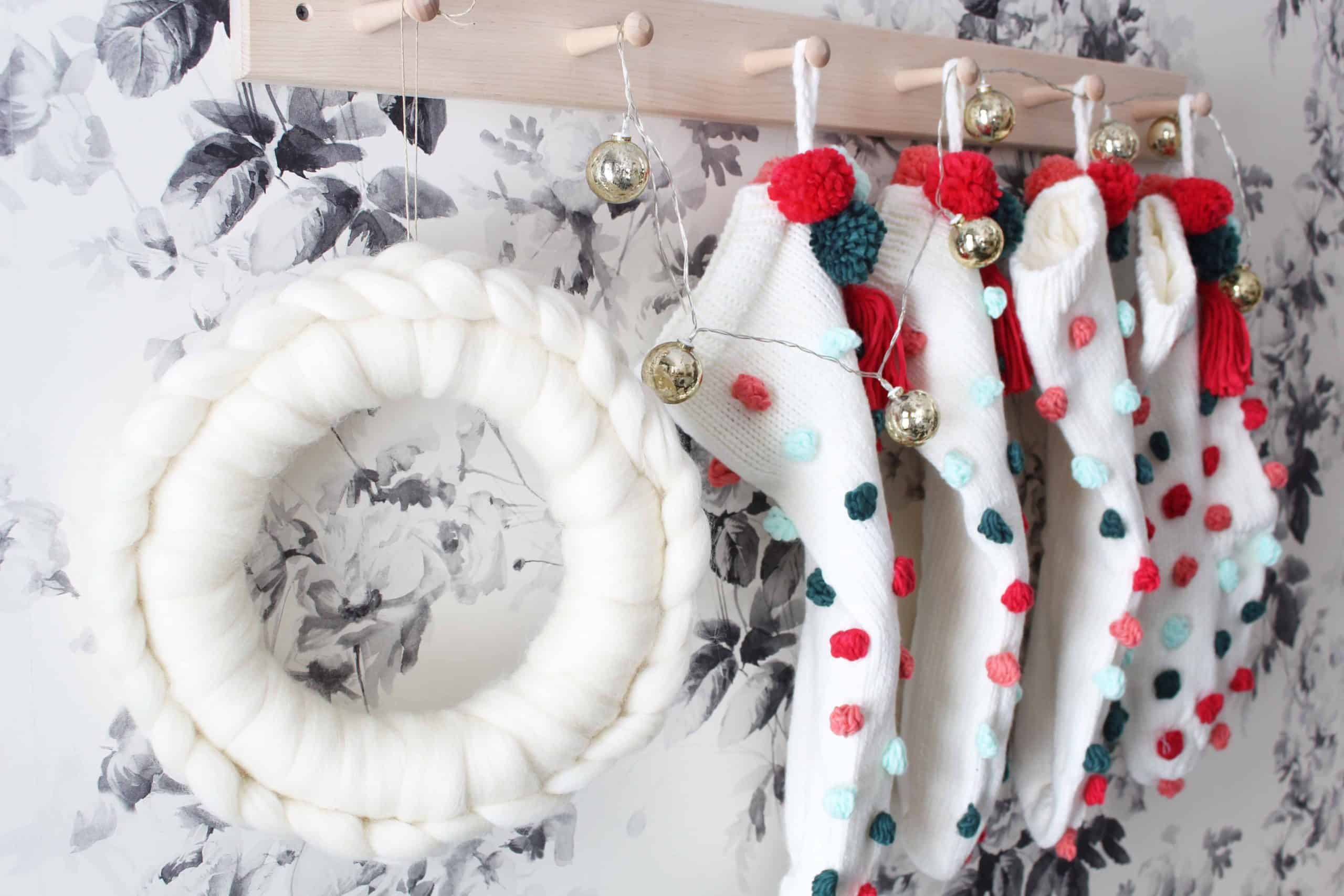 anthropologie white wool wreath, anthropologie christmas wreath, diy anthropologie wreath, anthropologie pom pom christmas stockings, smoky rose wallpaper by house of hackney