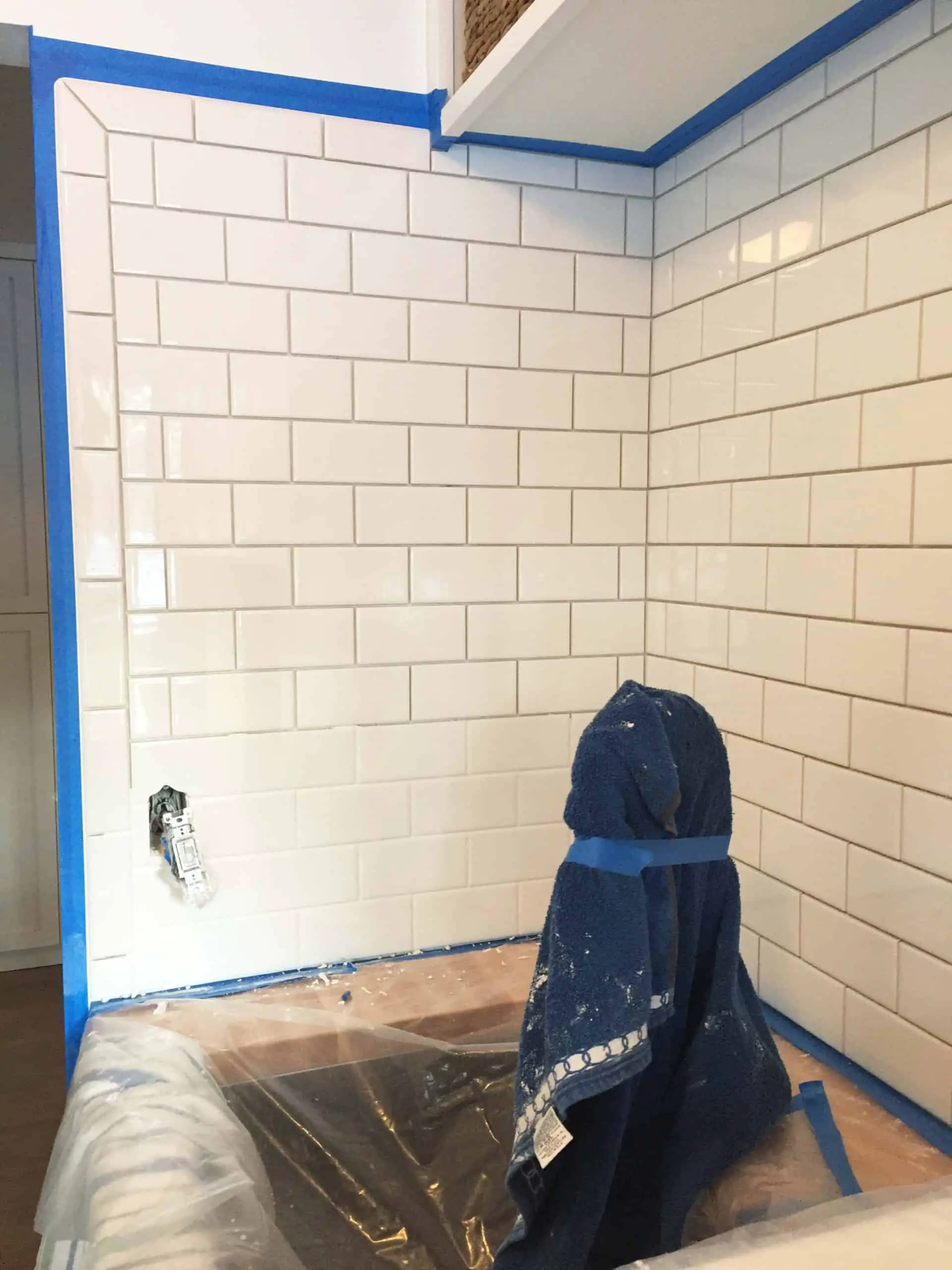 white subway tile backsplash in modern farmhouse laundry room