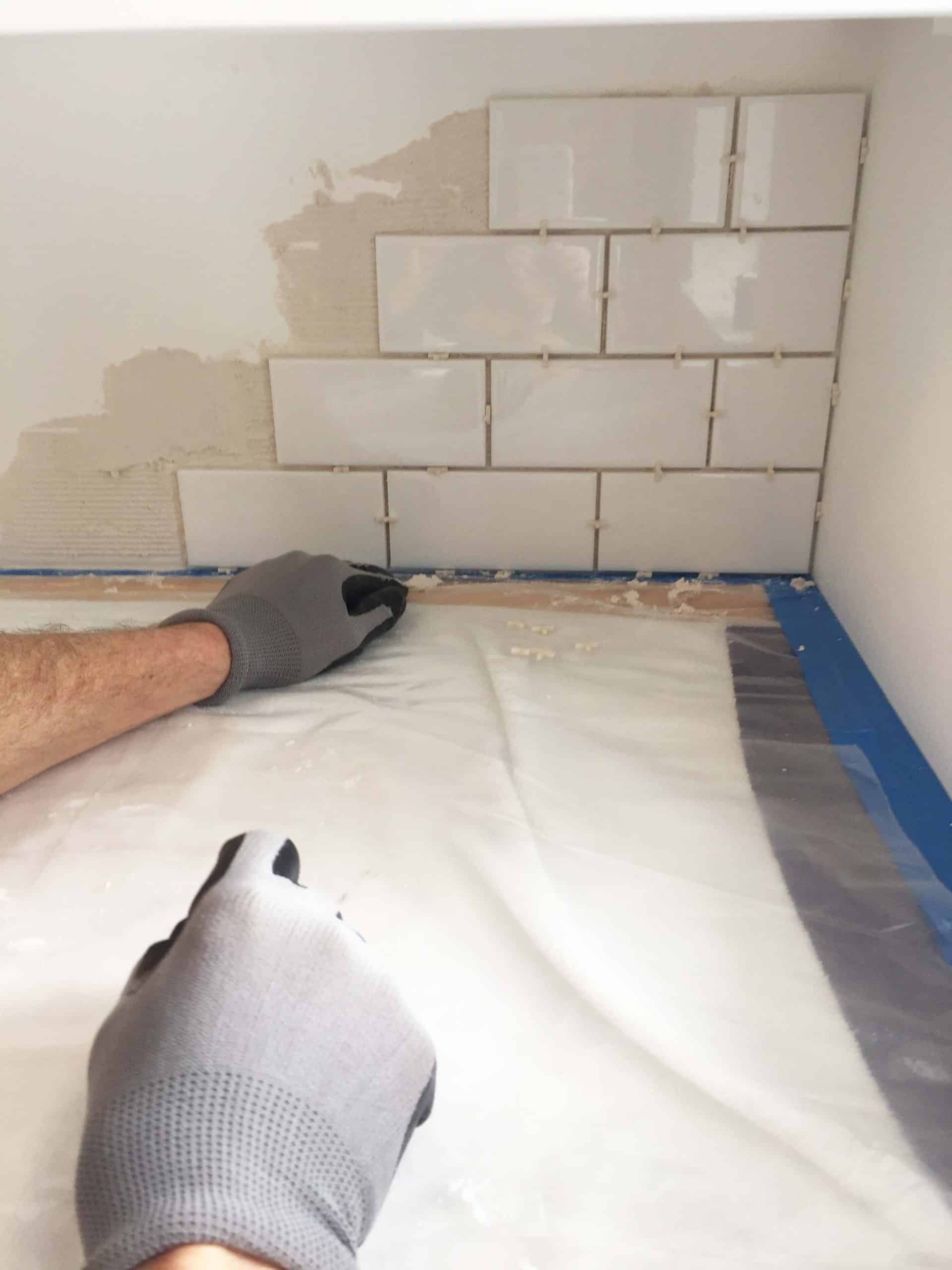 white subway tile backsplash in laundry room 