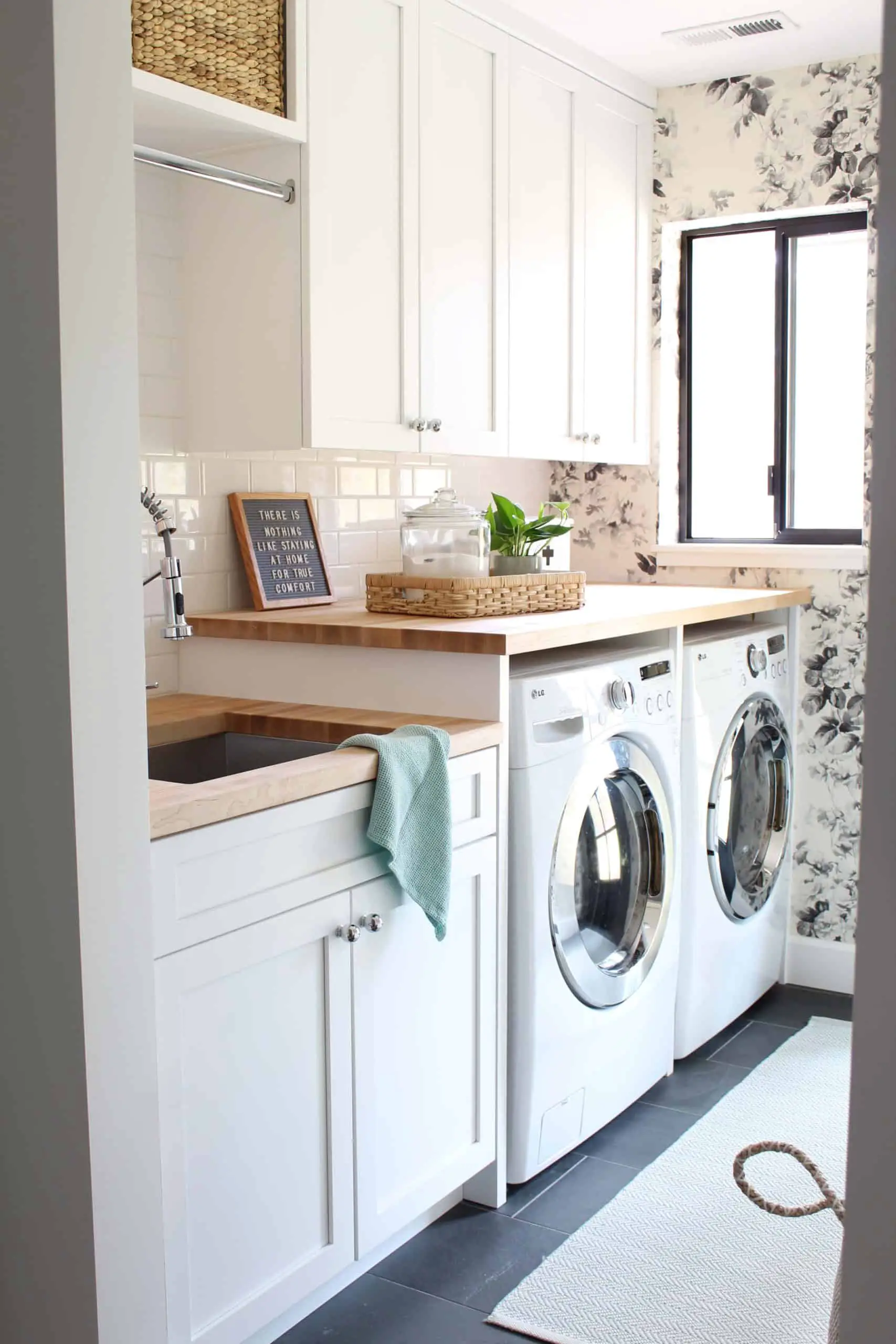 house of hackney smoky rose wallpaper, laundry room with butcher block counter tops, laundry room with slate tile floor, laundry room with two different height countertops, laundry room with white shaker cabinets