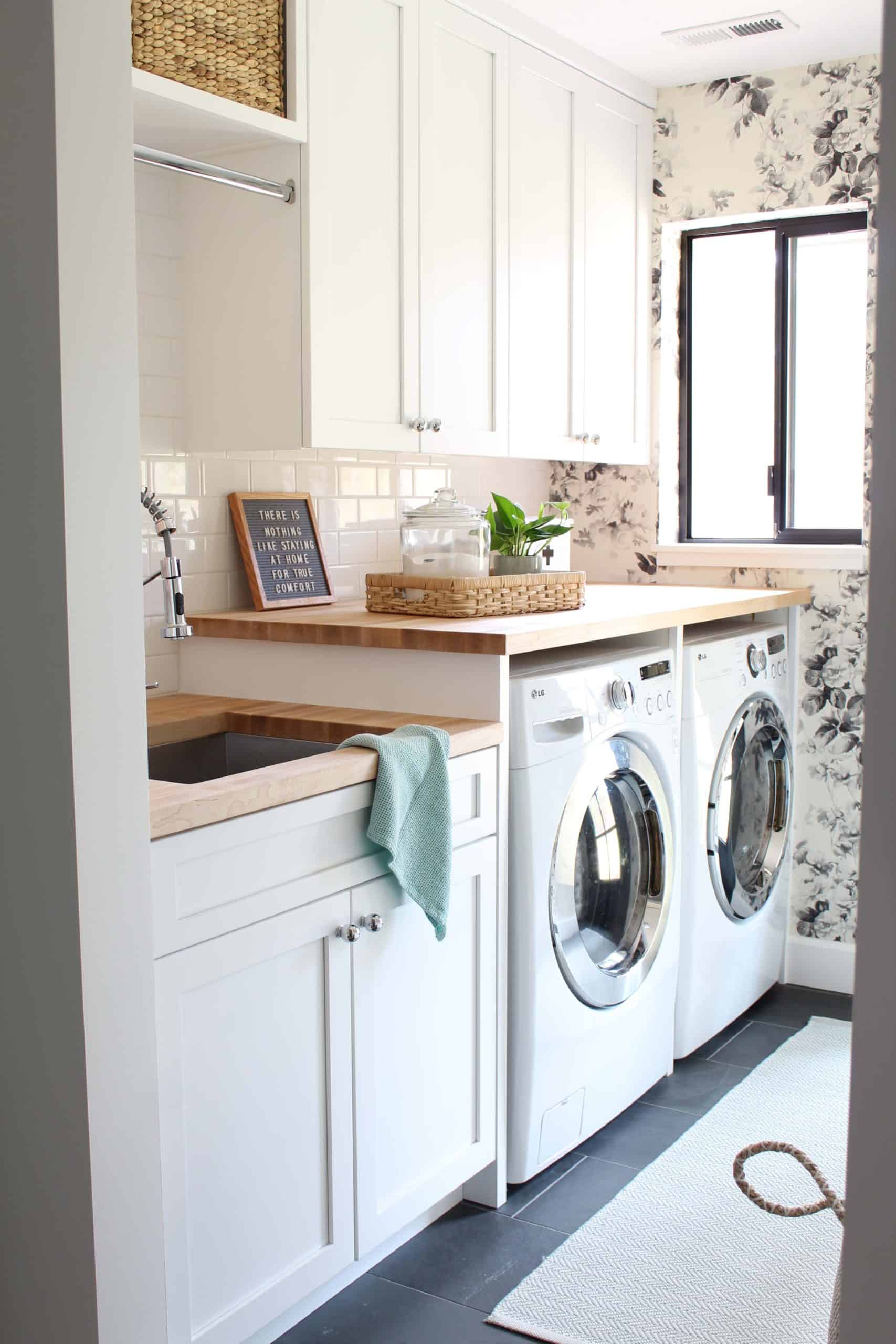 black and white floral wallpaper, laundry room with butcher block counters built over washer and dryer