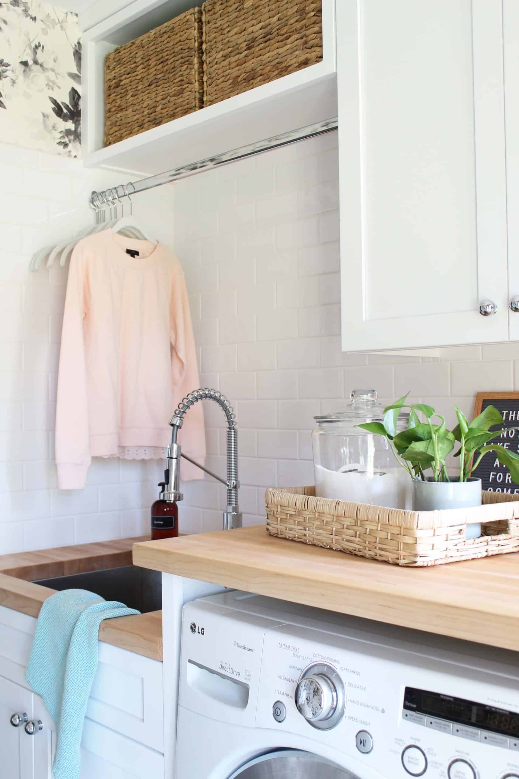 house of hackney smoky rose wallpaper, laundry room with butcher block counter tops, laundry room with slate tile floor, laundry room with two different height countertops, laundry room with white shaker cabinets