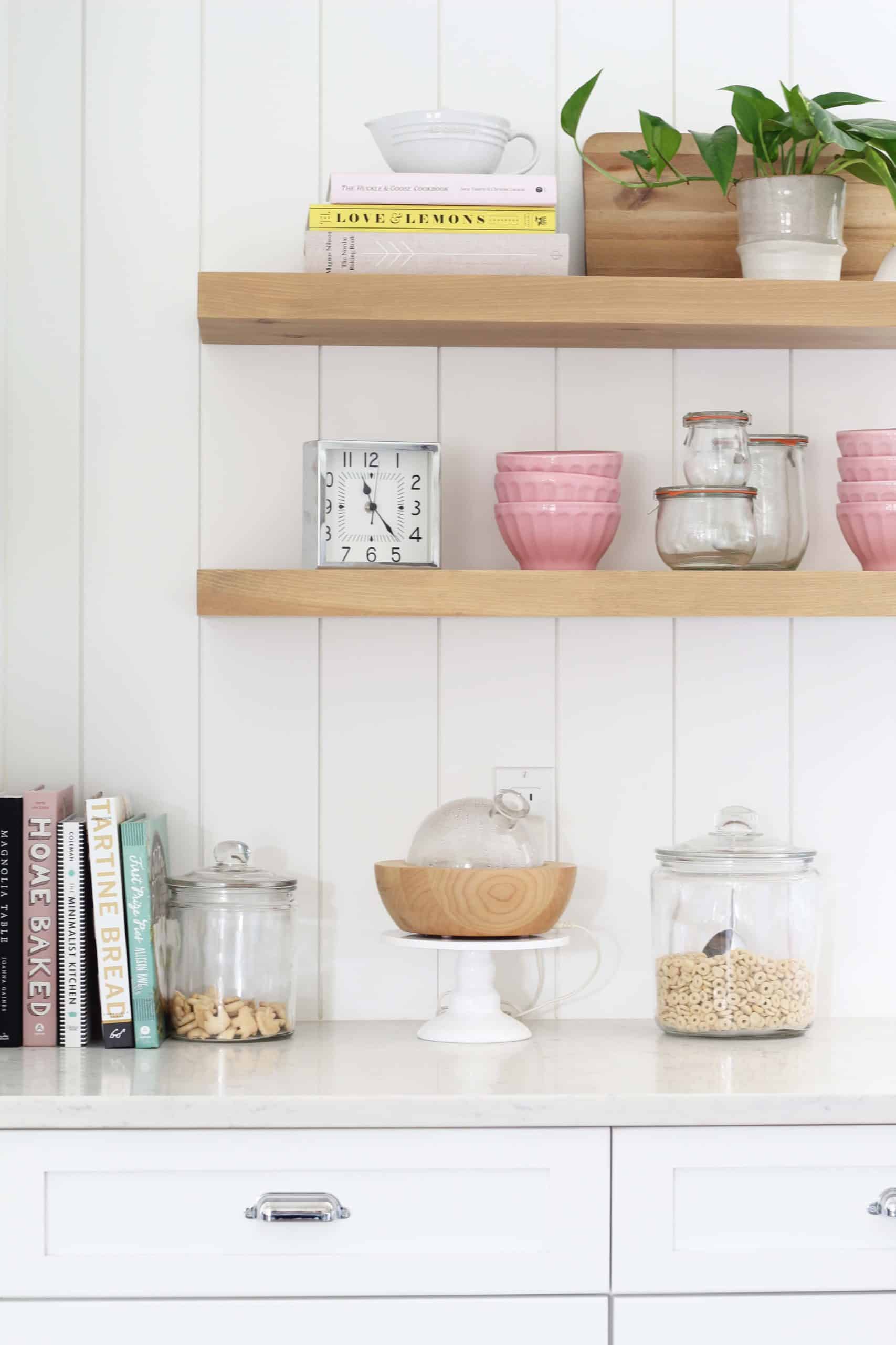 open floating shelves in kitchen with shiplap