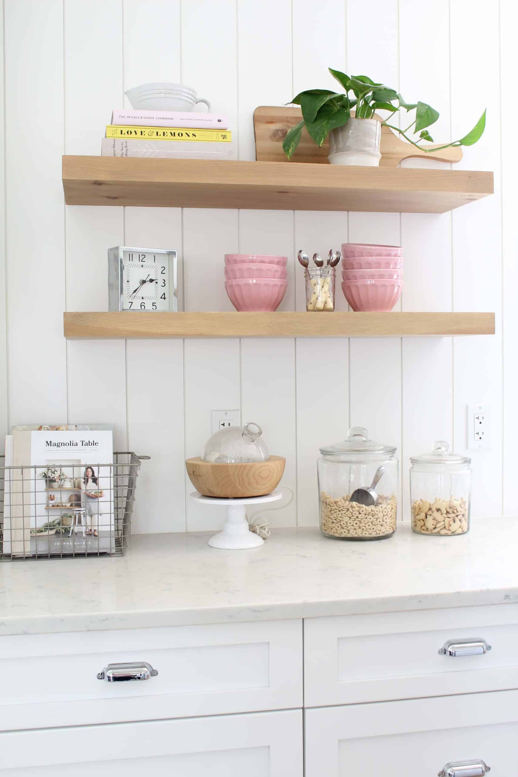 anthropologie pink latte bowls, gold polka dot coffee spoons, le crueset juicer, pathos in studio mcgee plant pot