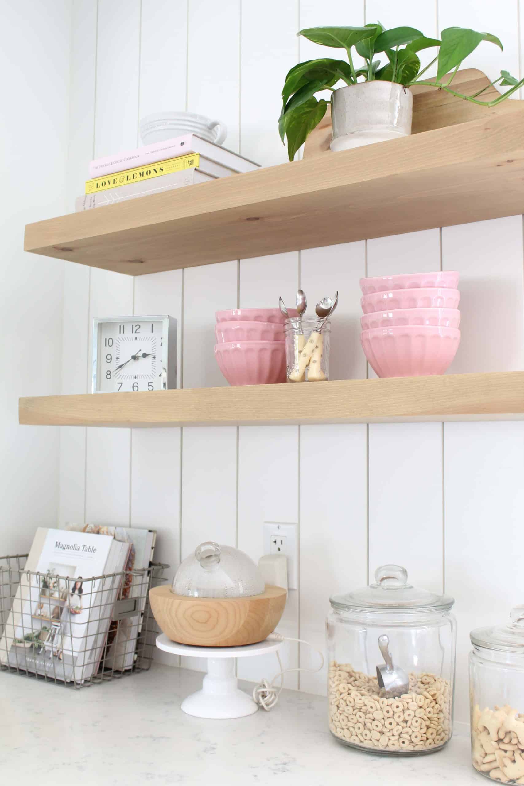 anthropologie pink latte bowls, gold polka dot coffee spoons, le crueset juicer, pathos in studio mcgee plant pot, magnolia home cook book 