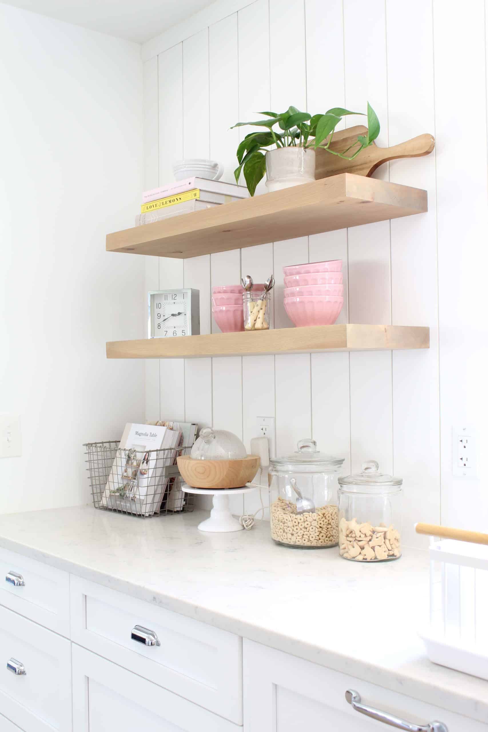 anthropologie pink latte bowls, gold polka dot coffee spoons, le crueset juicer, pathos in studio mcgee plant pot