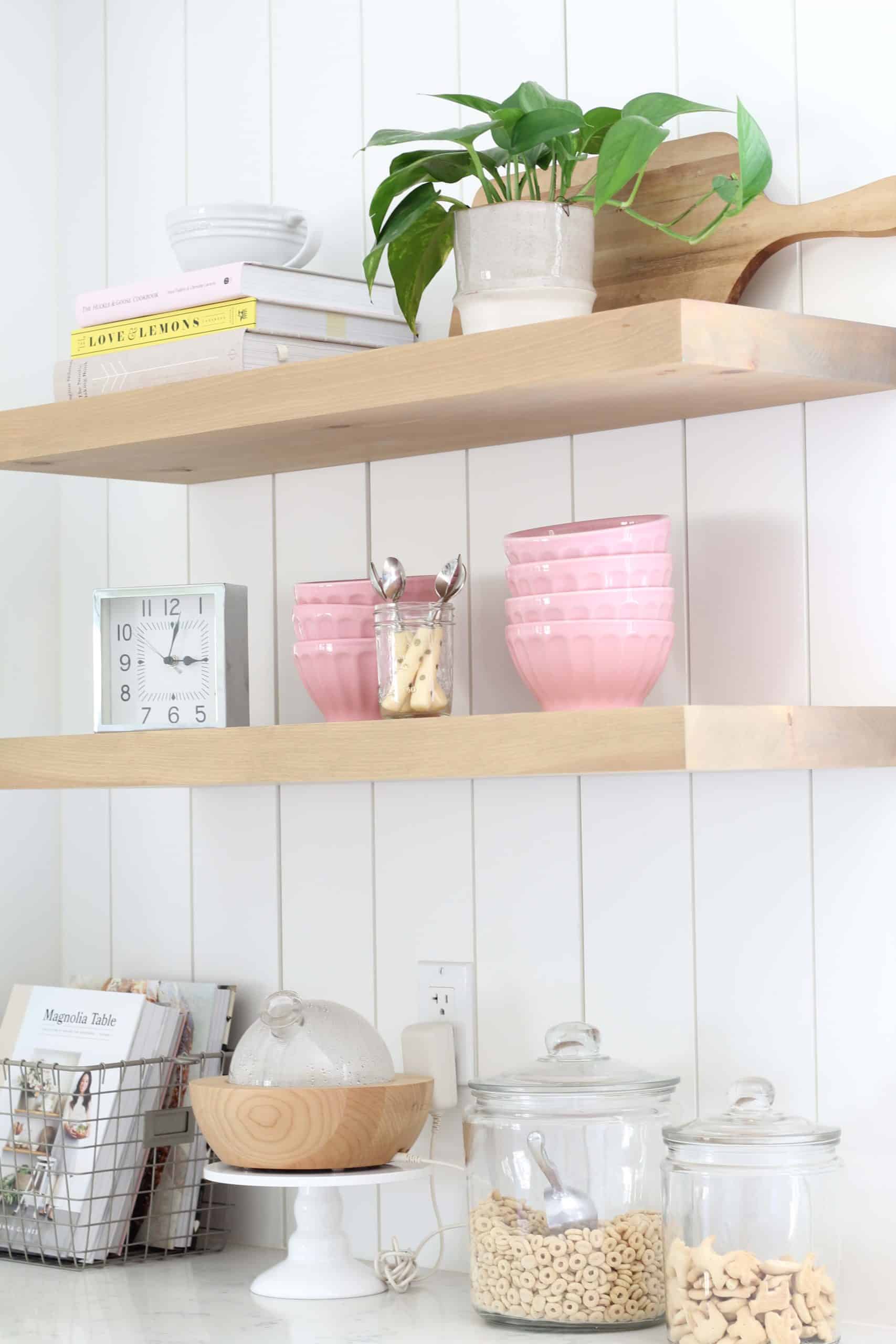 anthropologie pink latte bowls, gold polka dot coffee spoons, le crueset juicer, pathos in studio mcgee plant pot