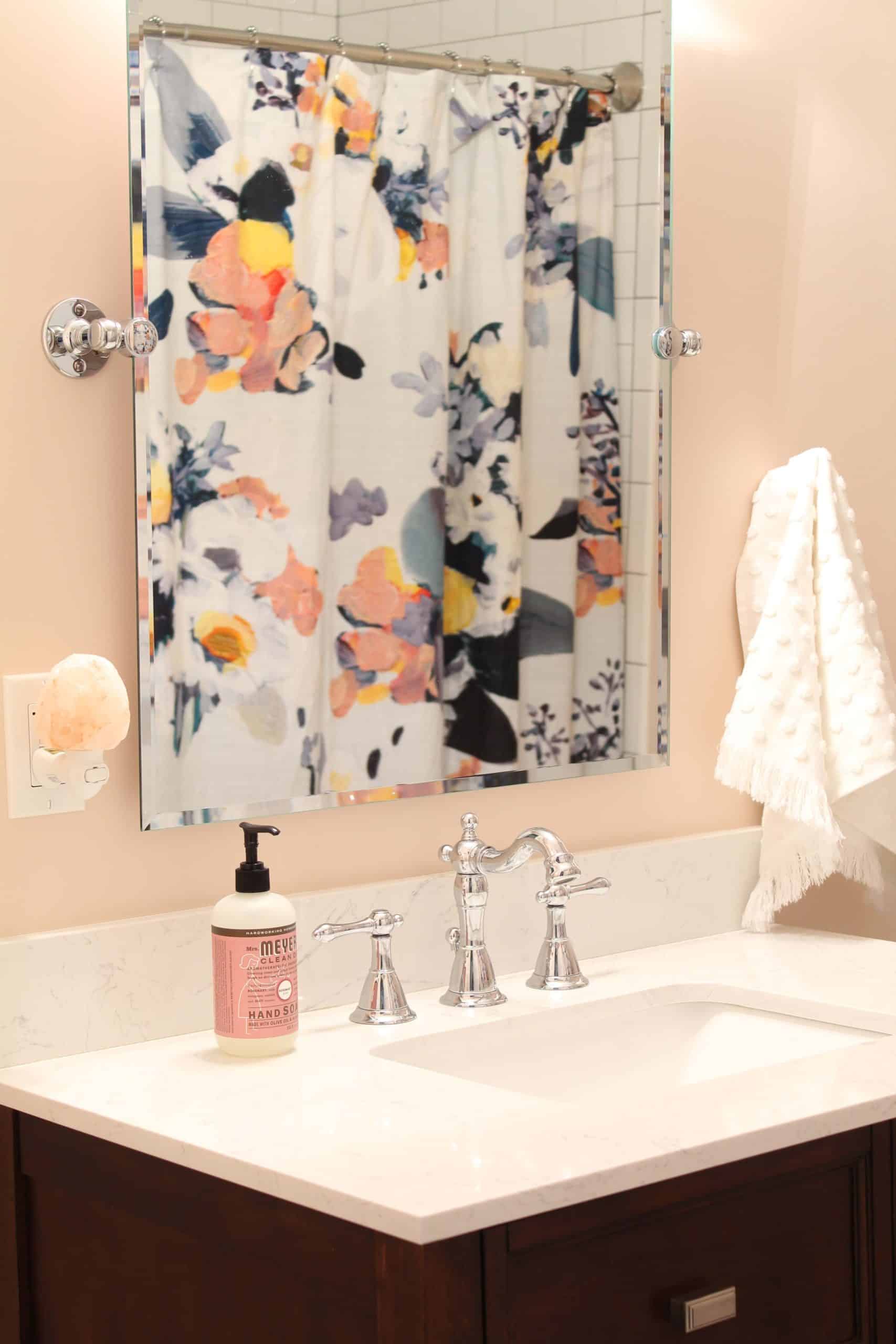 anthropologie botanica shower curtain, bathroom with pink walls, white polka dot towels, white subway tile shower surround, bathroom with hotel towel rack