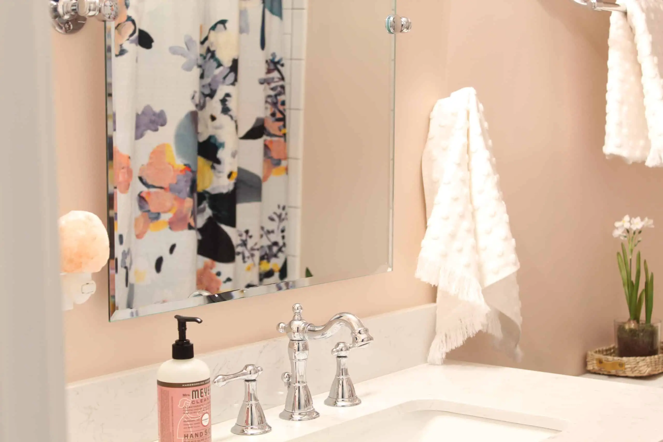 anthropologie botanica shower curtain, bathroom with pink walls, white polka dot towels, white subway tile shower surround, bathroom with hotel towel rack