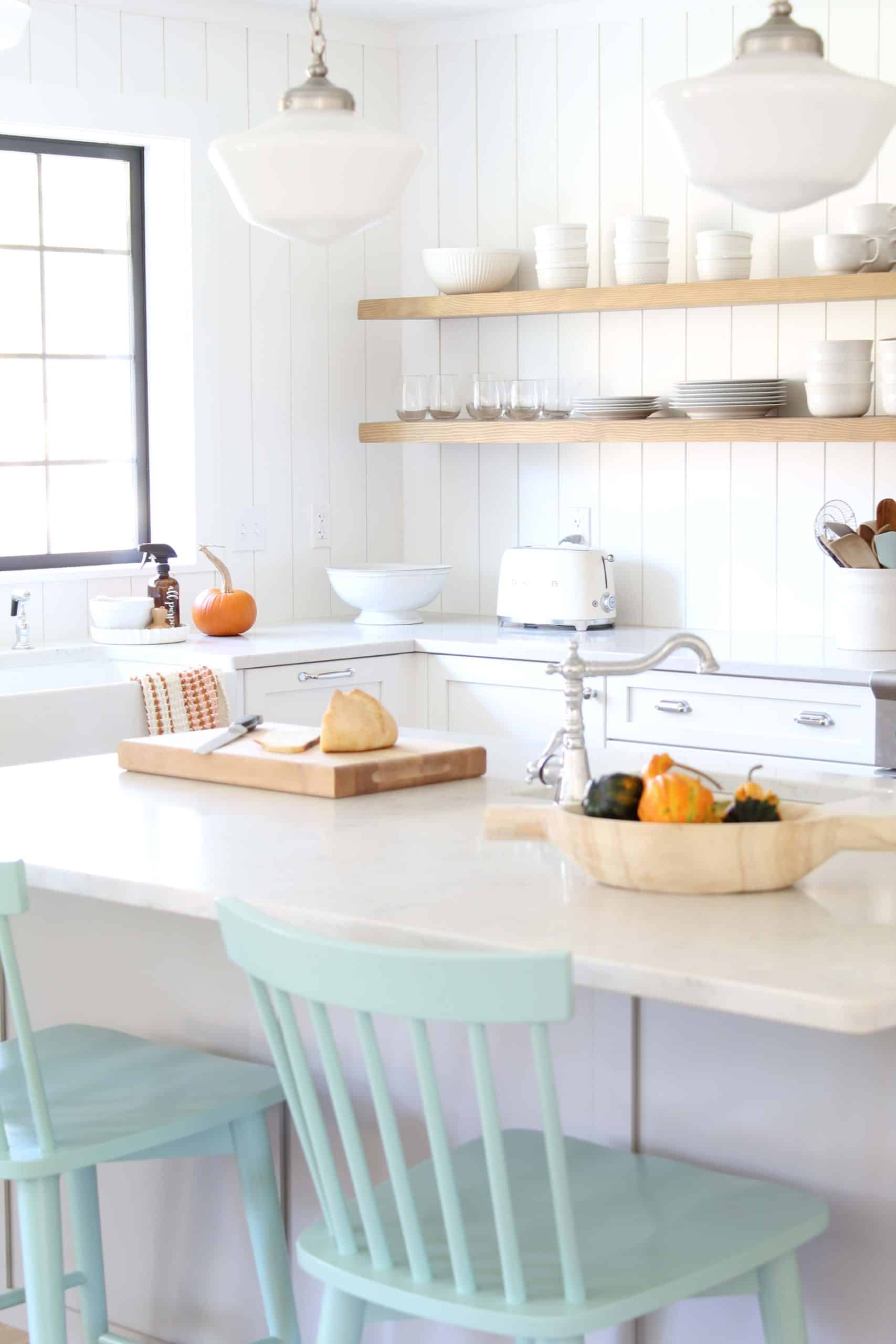 white kitchen with vertical tongue and groove backsplash 