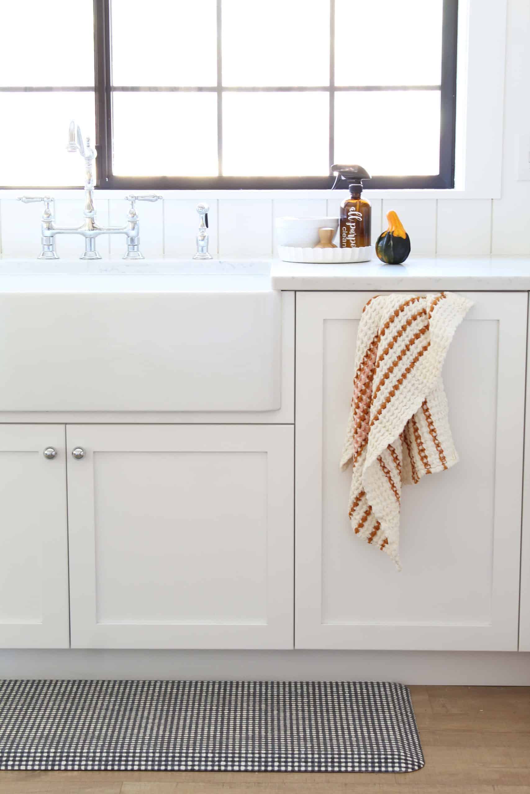 anthropologie fall dishtowel, farmhouse kitchen sink in white kitchen