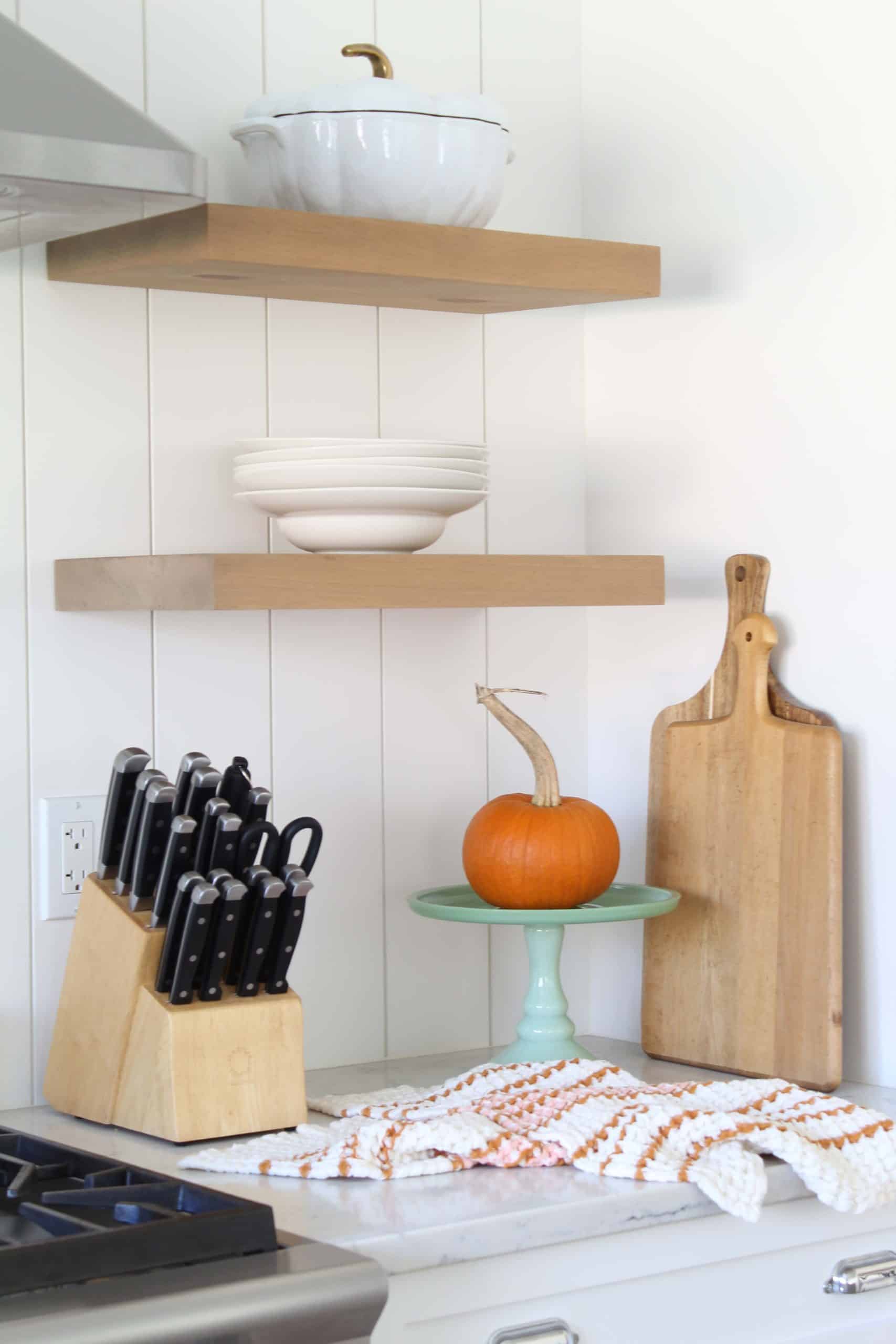 white kitchen with pumpkin on green cake stand, staub white pumpkin cocotte 