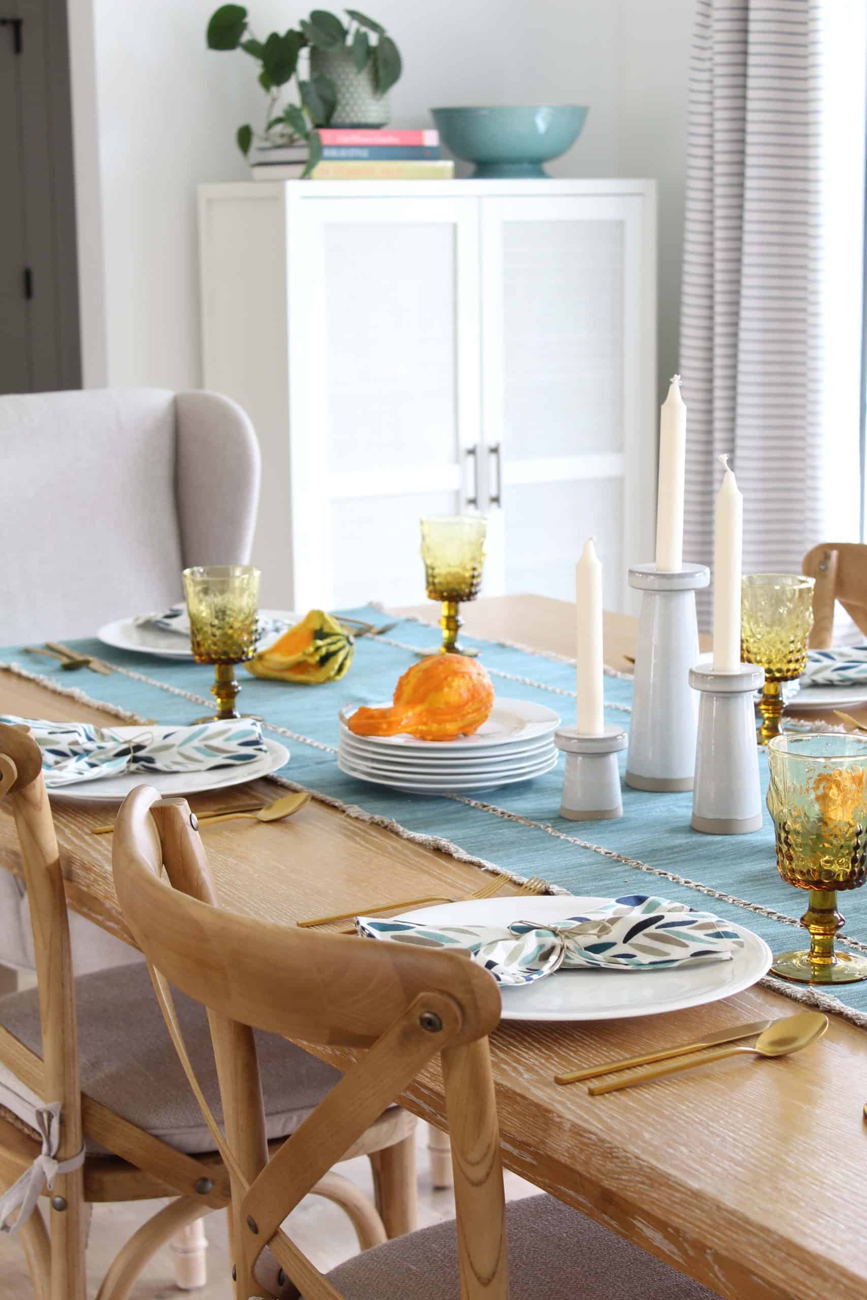 target warwick cabinet, large farmhouse table, modern candlesticks, aqua table runner